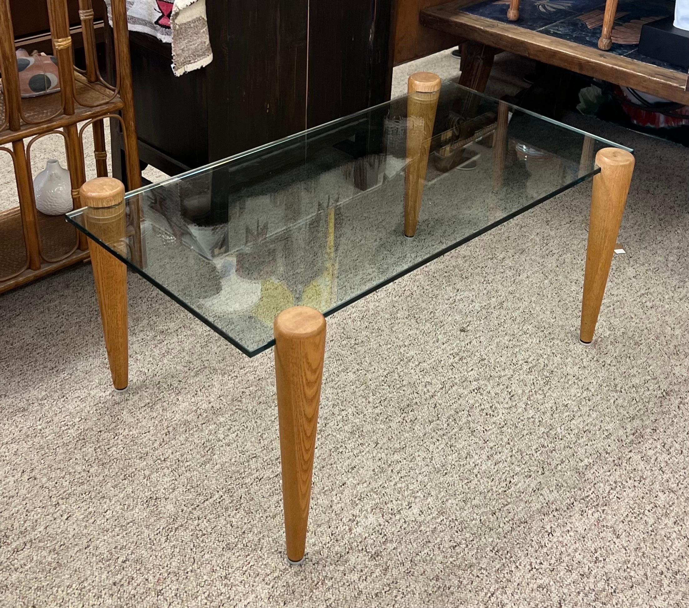 Vintage Mid-Century Modern Coffee Table with Glass Top Solid wood Legs

Dimensions. 40 W ; 24 D ; 18 H.