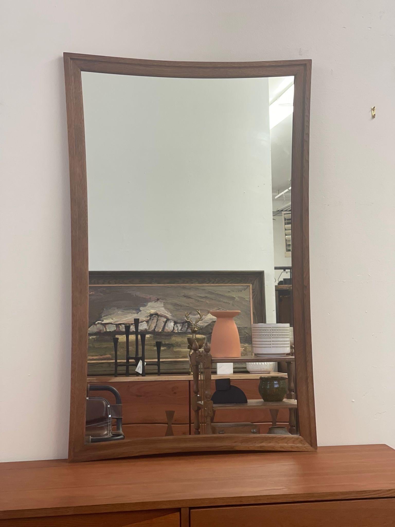 Glass Vintage Mid Century Modern Concave Sided Wall Mirror. For Sale