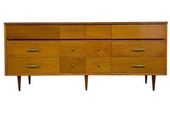 Vintage Mid Century Modern Credenza Dresser with 12 Drawers and Tapered Legs.