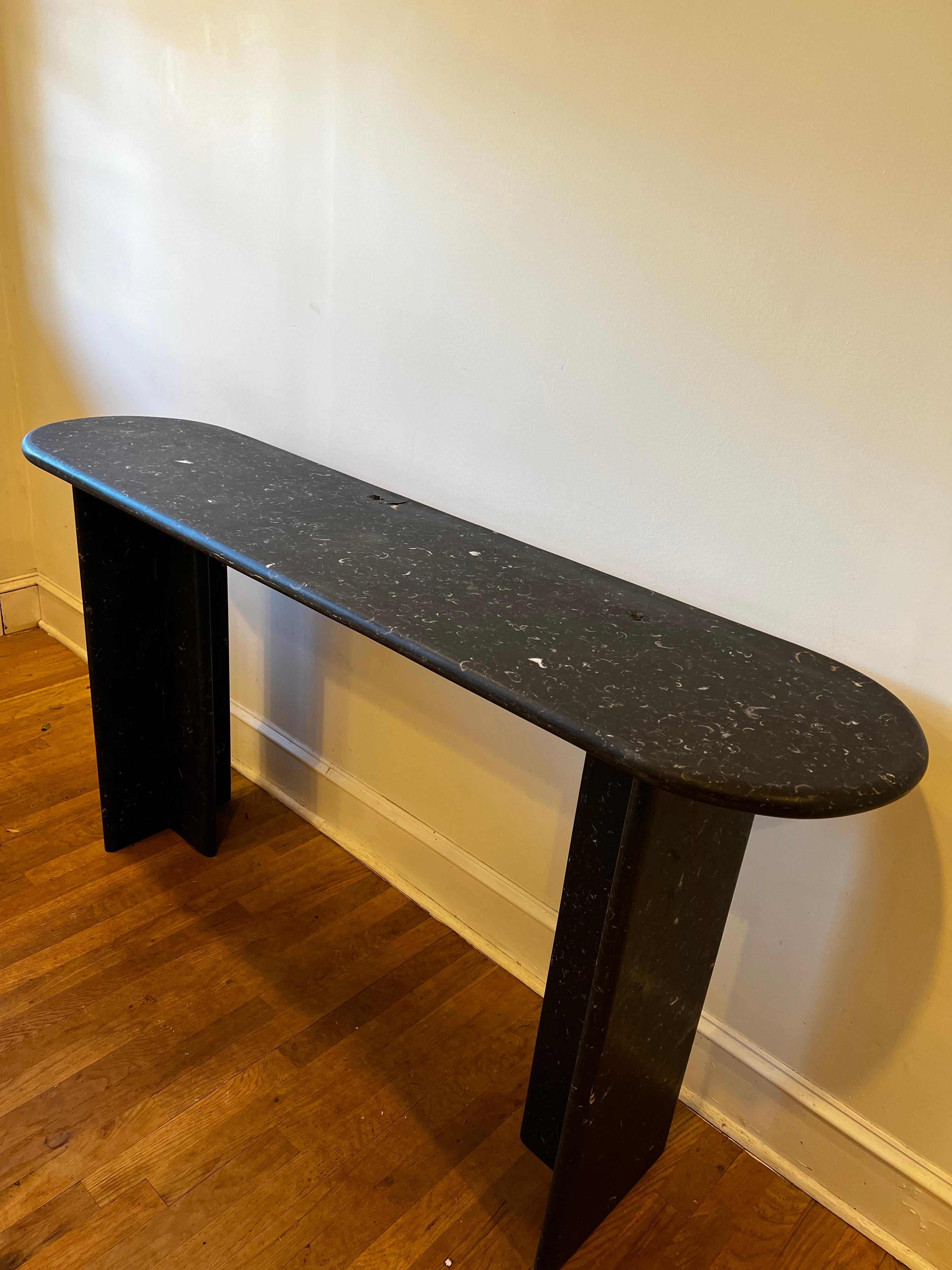 Vintage Mid Century Modern/Art Deco Black Marble Console Table. 
Three pieces include two legs and top. 

Top has curved edges as well as each leg giving it a modern/contemporary style.
Imported from Colombia. 

Matching end table available.