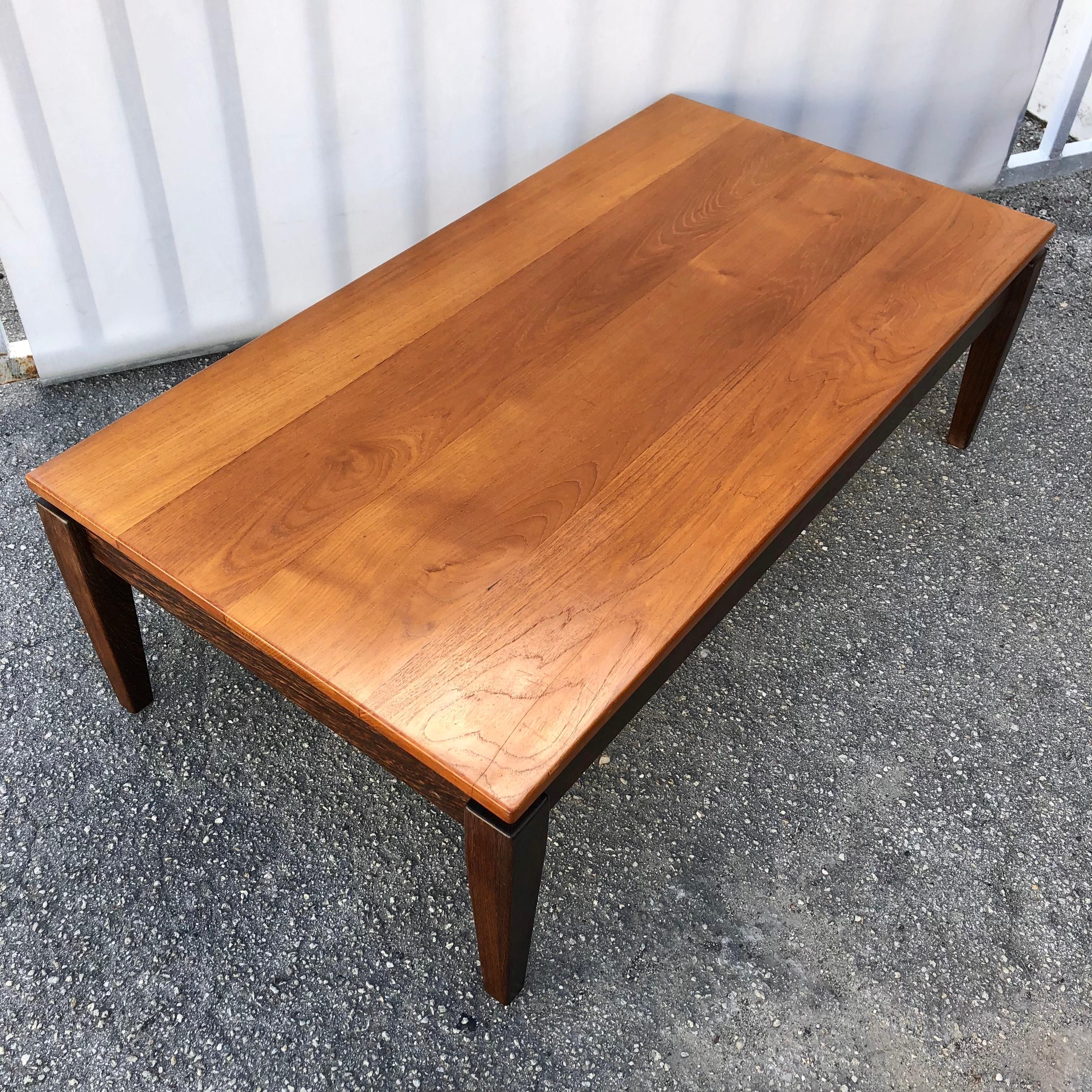 Vintage Mid Century Modern Custom Crafted Solid Wood Coffee Table, Signed by the maker. Circa 1960s. 
Features a sleek minimalist design with a solid wood floating top with contrasting color legs, a beautiful wood grain, and a magnificent