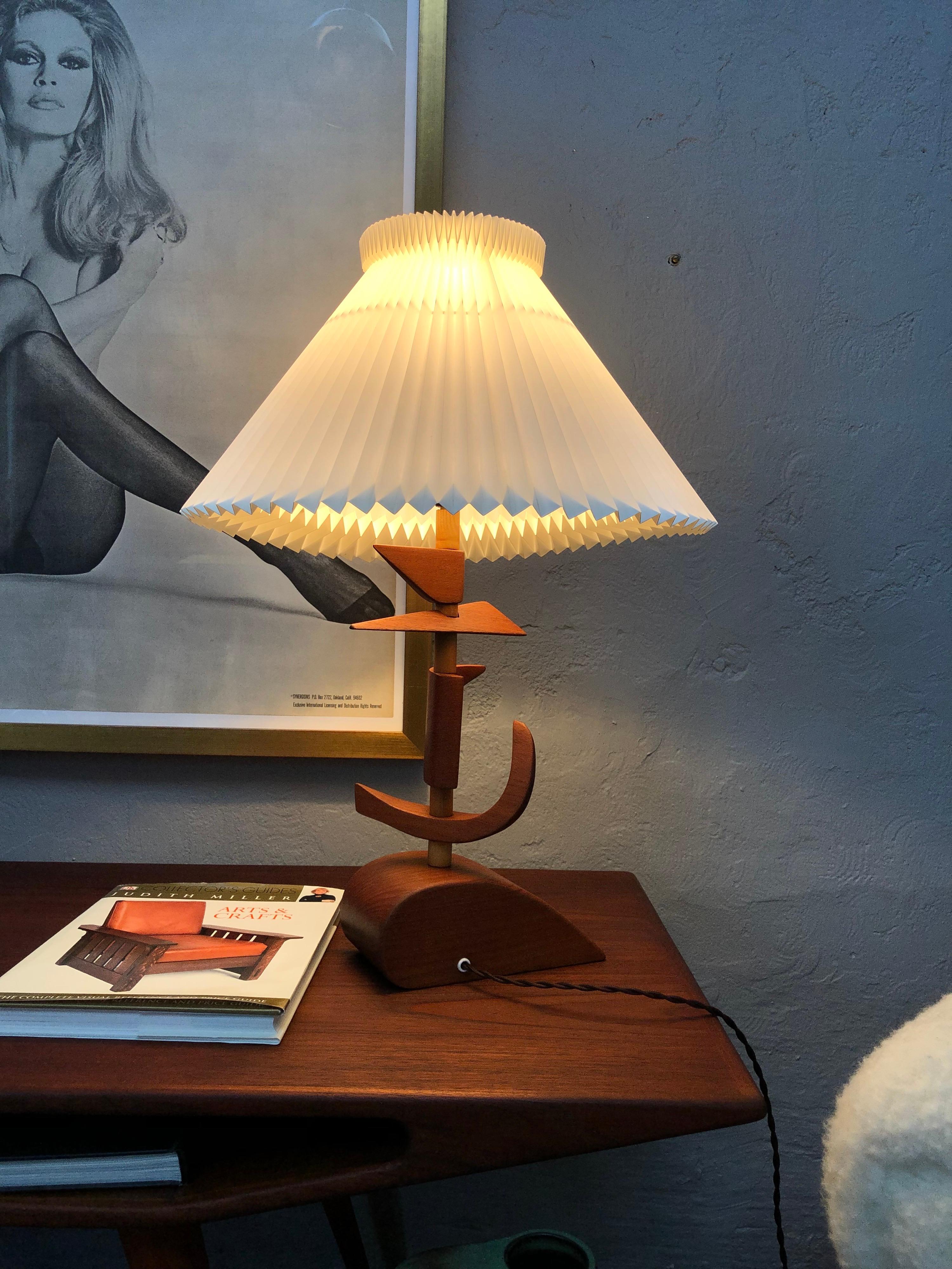 Vintage Mid-Century Modern Danish artisan prototype teak table lamp.
This is an amazing lamp that i immensely enjoyed renovating.
The lamp can only be one of two things. Either it is a prototype or a furniture maker has made it out of discarded teak