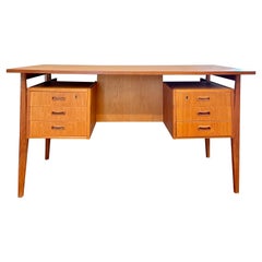 Vintage mid century modern danish desk with a floating too