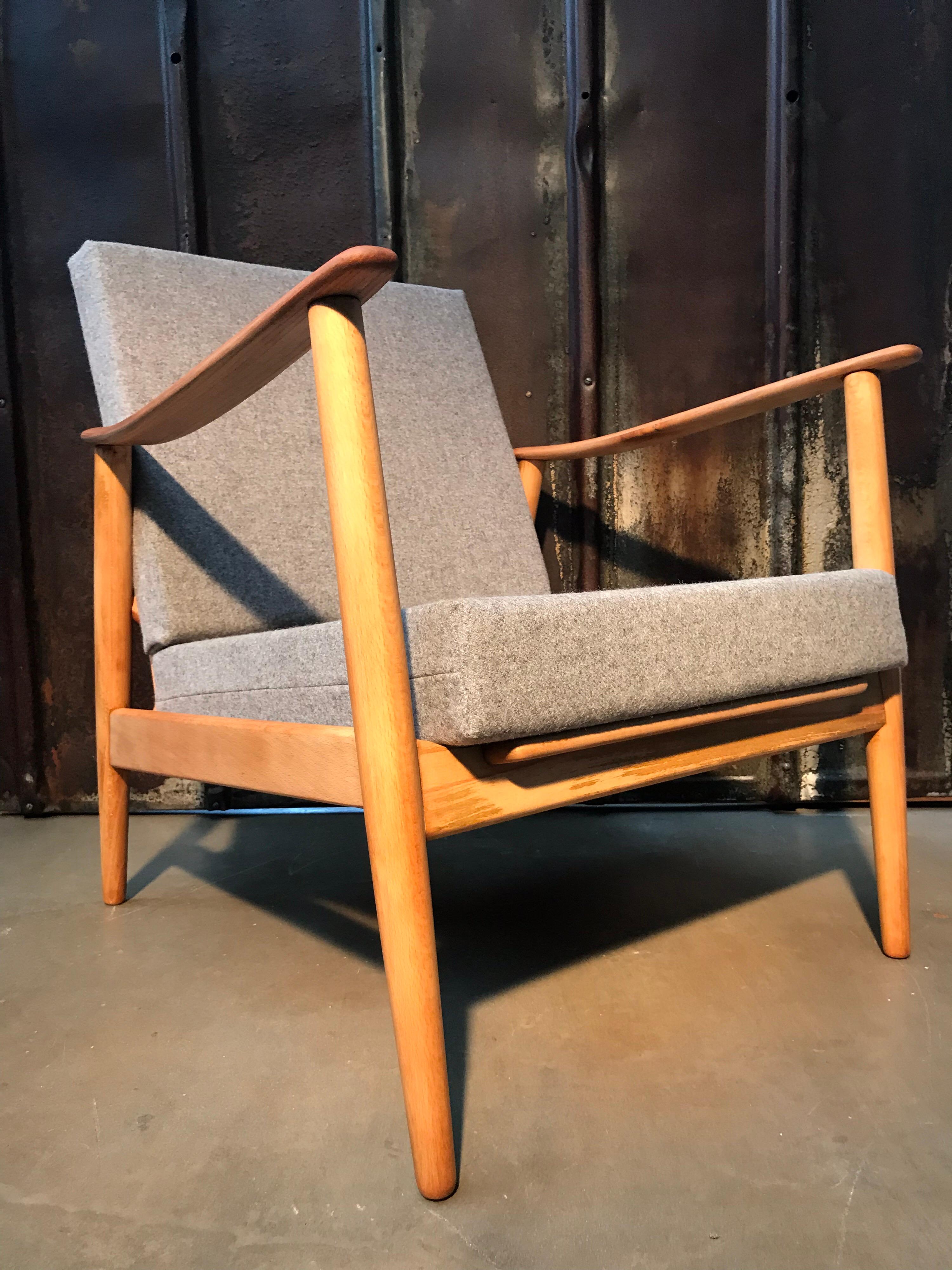 Vintage Danish Mid-Century Modern easy lounge chair in beech wood. 
This chair has been totally refurbished and with new foam and covers in 100% New Zealand lambs wool.
The beech wood has had all the old dark varnish removed by sanding and been