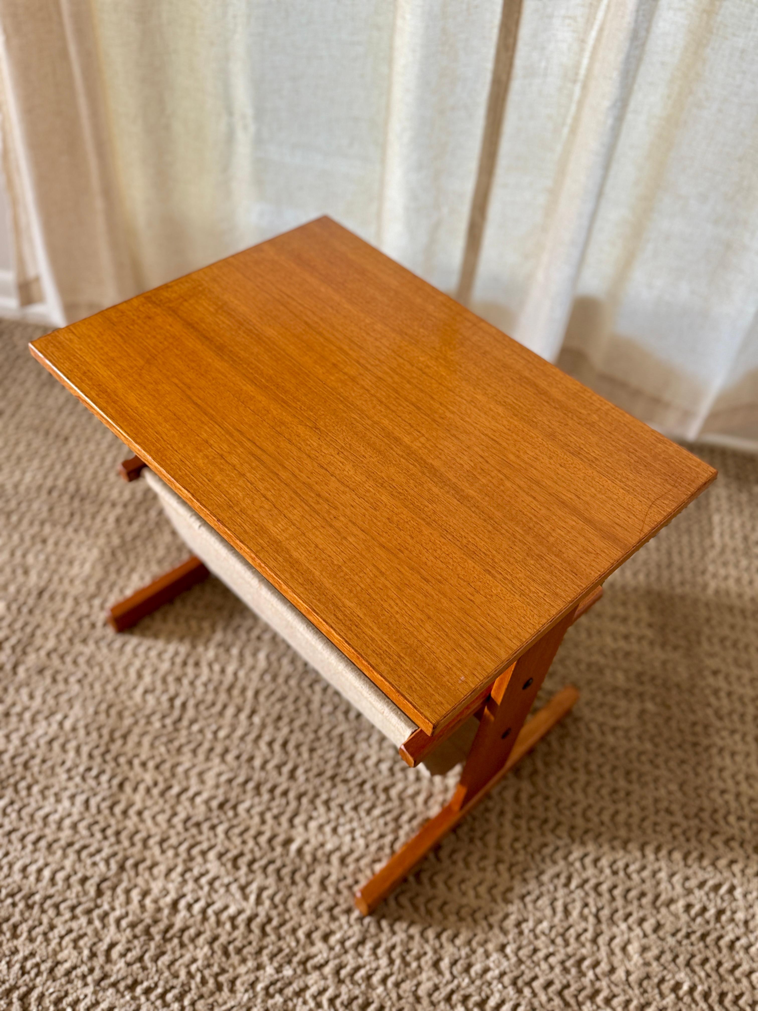 Vintage mid century modern Danish magazine table made of teak and canvas For Sale 5