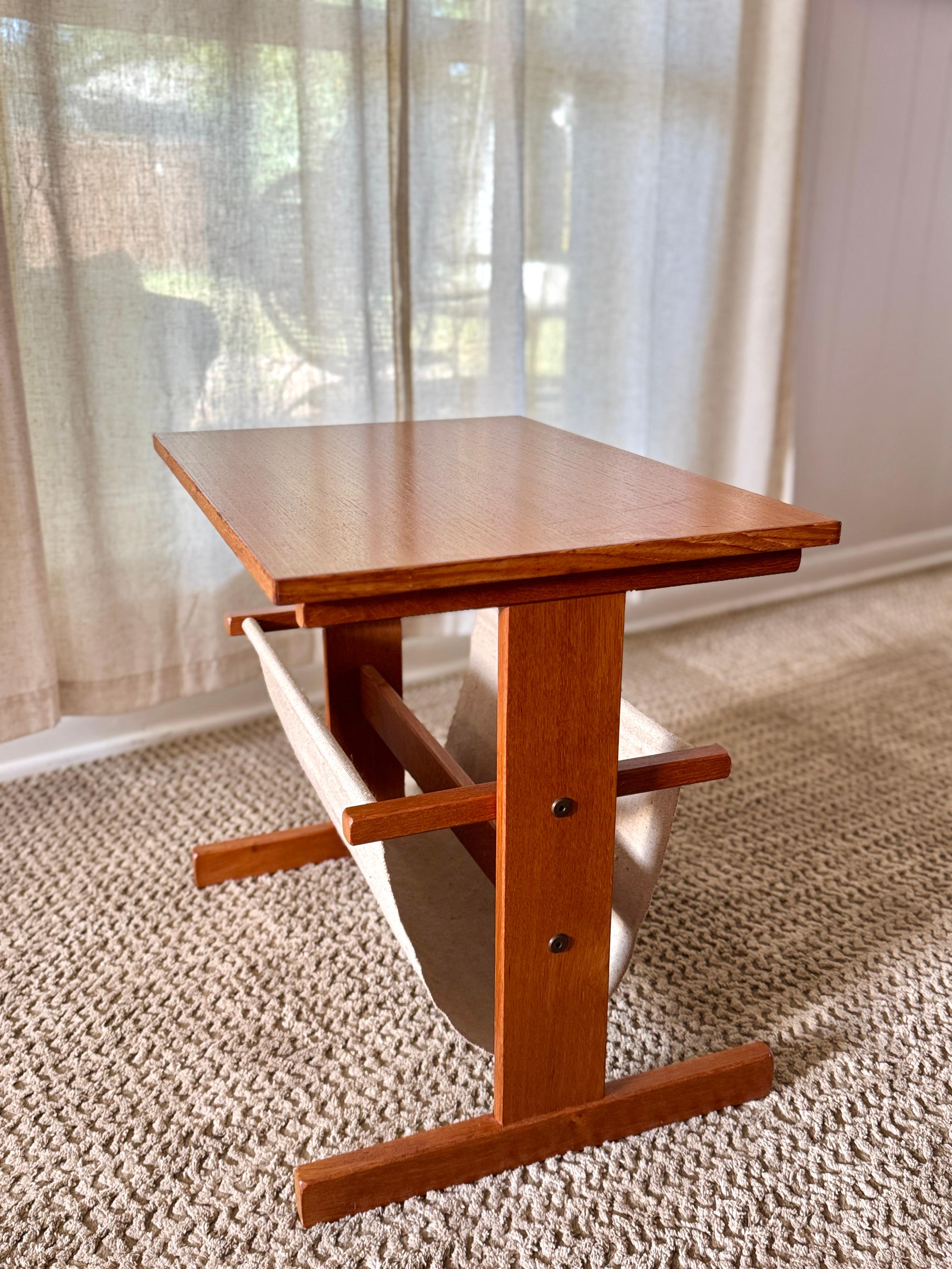 Teak Vintage mid century modern Danish magazine table made of teak and canvas For Sale
