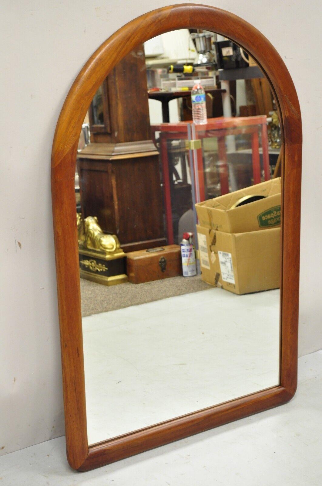 Vintage Mid-Century Modern Danish style teak wood arched mirror by Lenoir. Item features solid teak frame, original stamp, very nice vintage item, clean modernist lines, great style and form. Circa mid 20th century. Measurements: 42