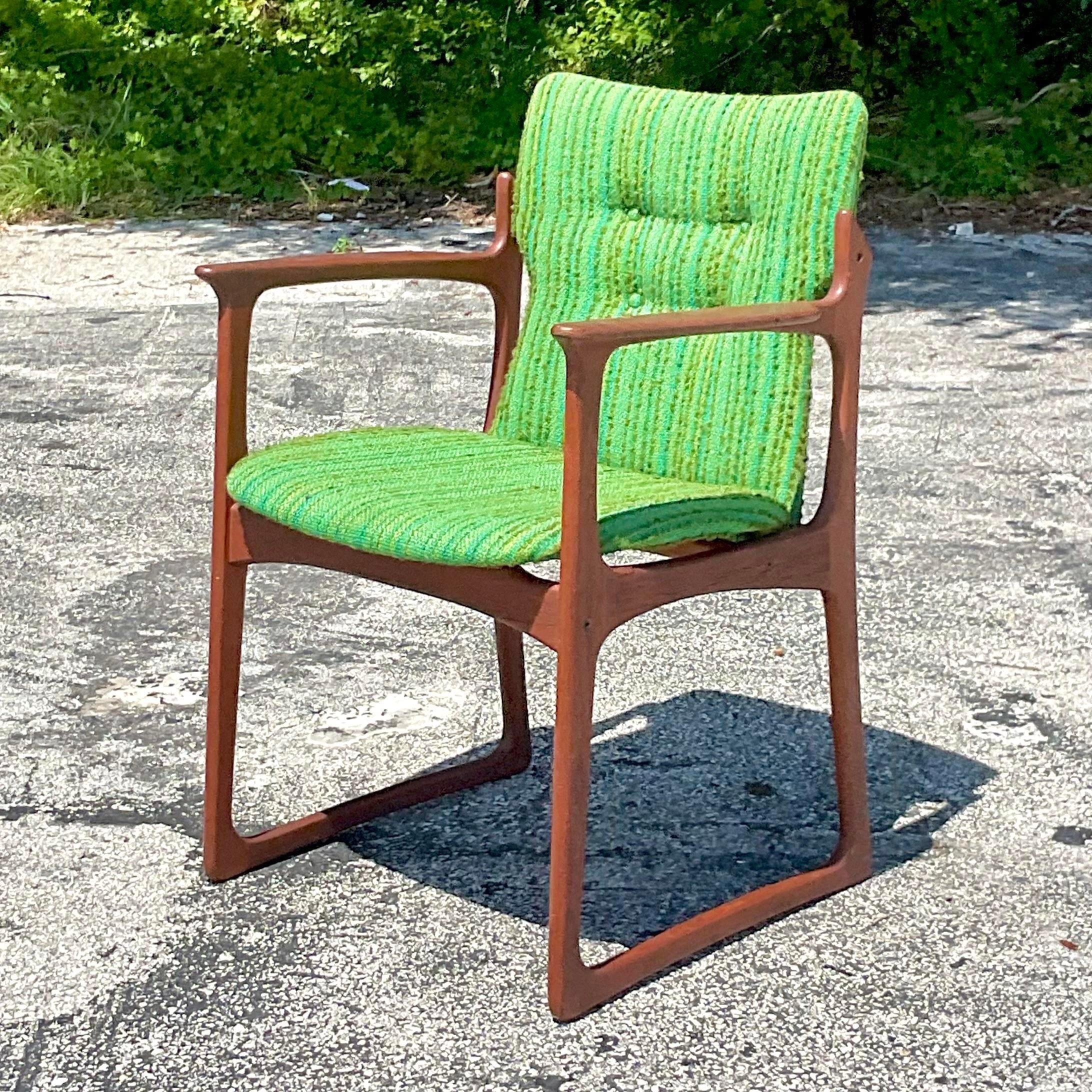 A fantastic vintage Danish arm chair. Made by the coveted Vamdrup Stolefabrik group. Marked Made in Denmark on the bottom. A beautiful original green striped boucle upholstery. Acquired from a Palm Beach estate.