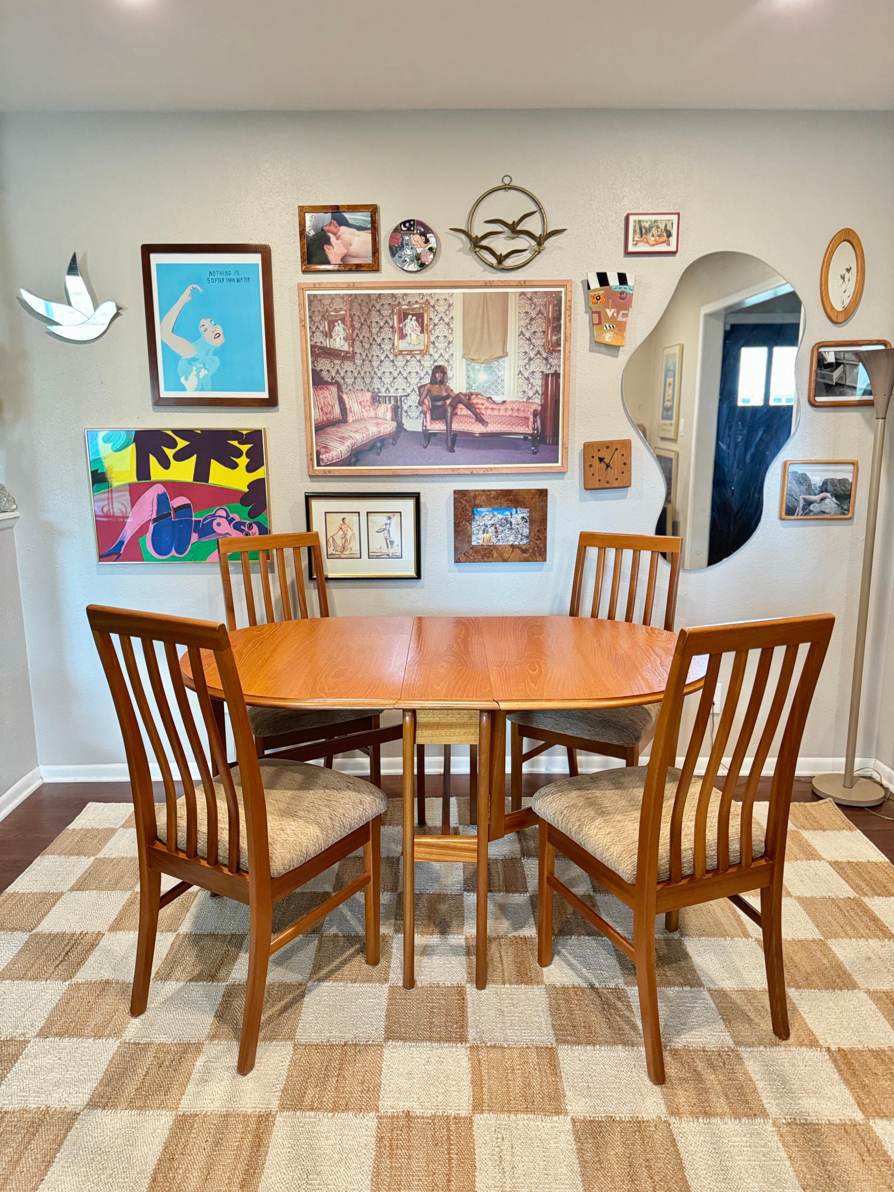 Vintage mid century modern dining set including a drop leaf table and 4 chairs In Good Condition In Houston, TX