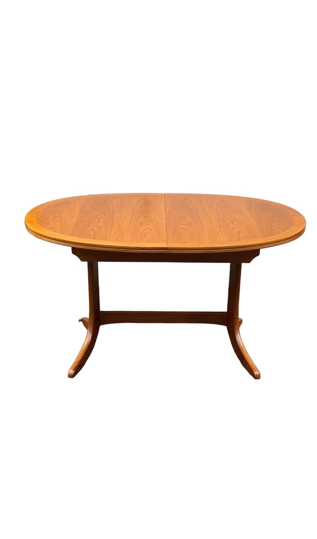 (Available by Online Purchase Only)

Vintage Mid-Century Modern dining table with butterfly leaf. UK Import.

Dimensions. 53 W ; 36 D ; 29 1/2 H.