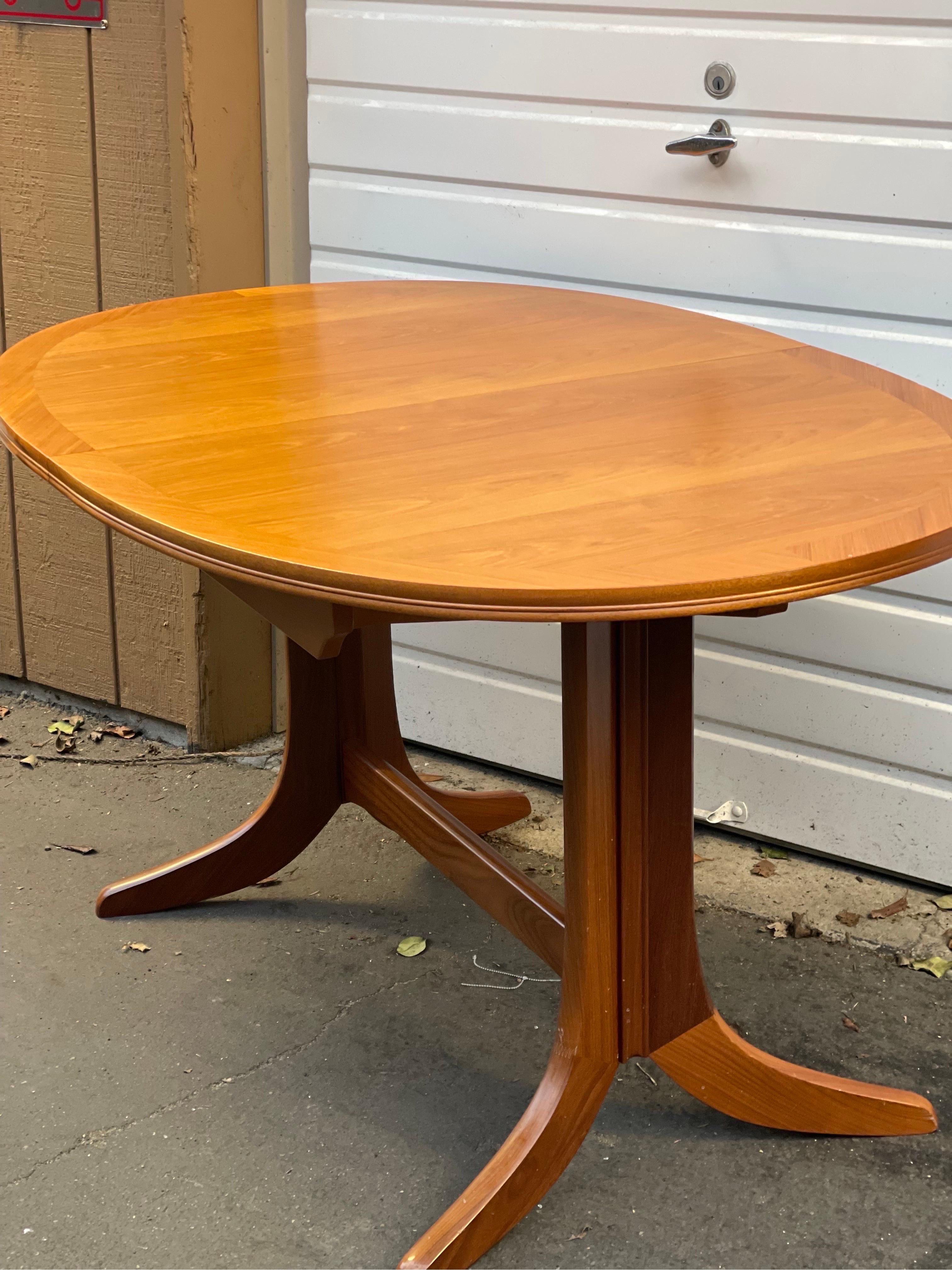 oval butterfly leaf dining table