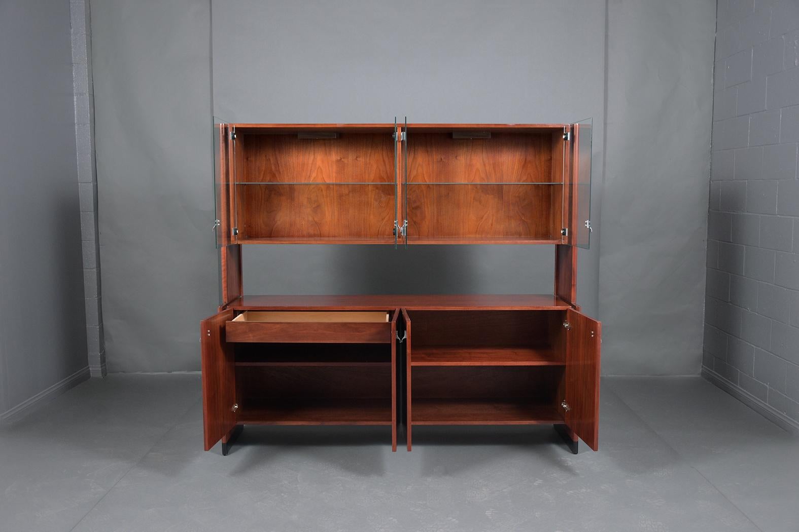 Discover the charm of the 1960s with our Mahogany Cabinet, a testament to mid-century elegance and craftsmanship. Hand-crafted from high-quality mahogany wood, this piece has been professionally restored to ensure it retains its timeless beauty and
