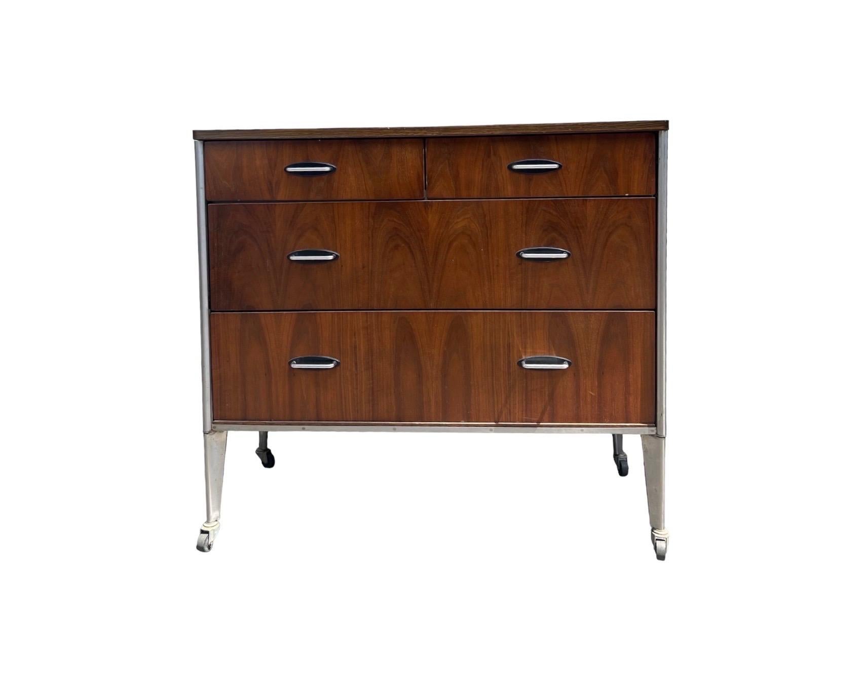 Vintage Mid Century Modern Dresser By Raymond Loewy For Hill Rom , Walnut With Casters

Dimensions. 39 1/2 W ; 17 1/2 D ; 36 H
     Mirror. 62 H