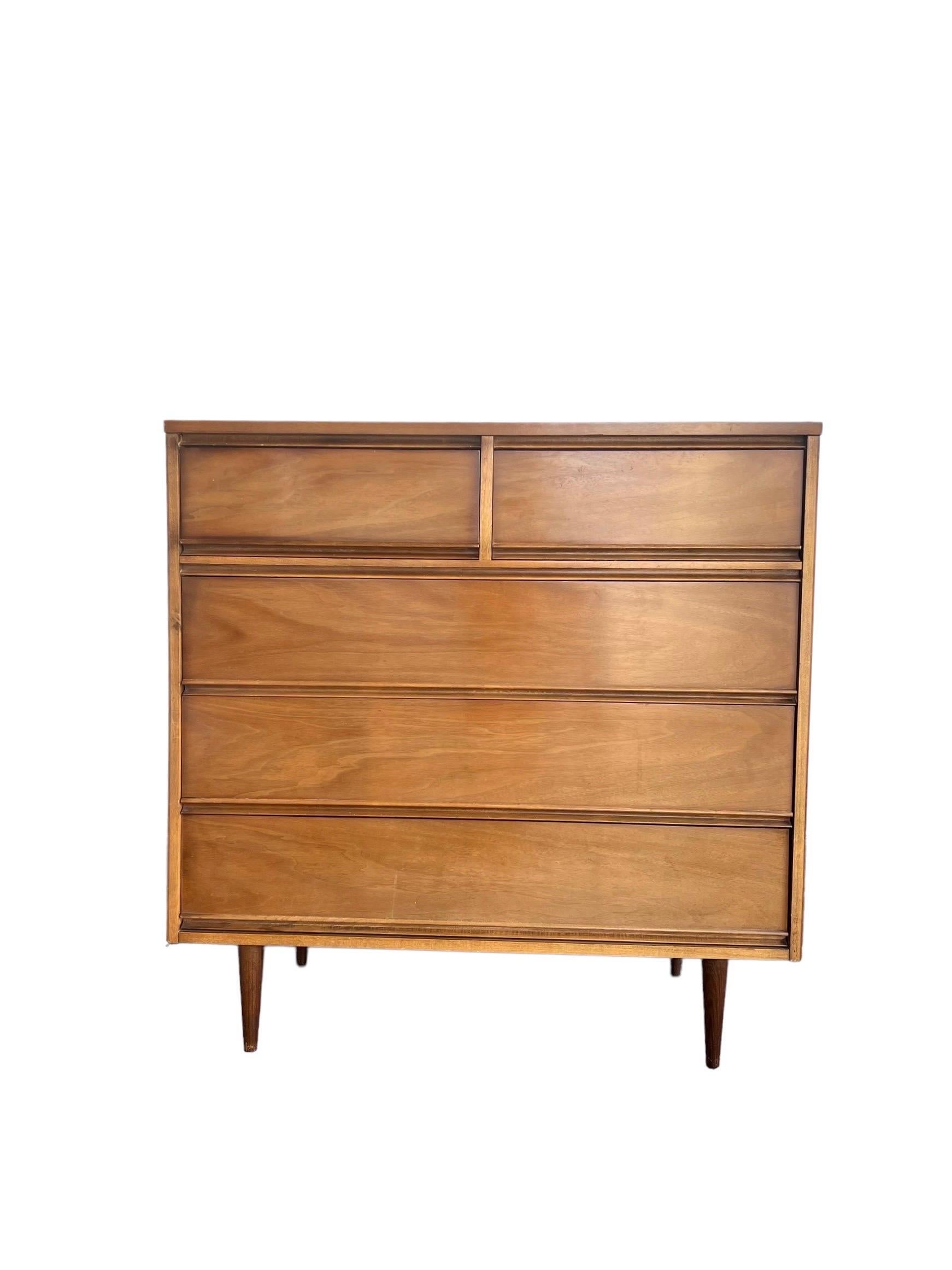 Vintage Mid-Century Modern dresser dovetailed drawers walnut.

Measures: 41W, 19D, 42H.