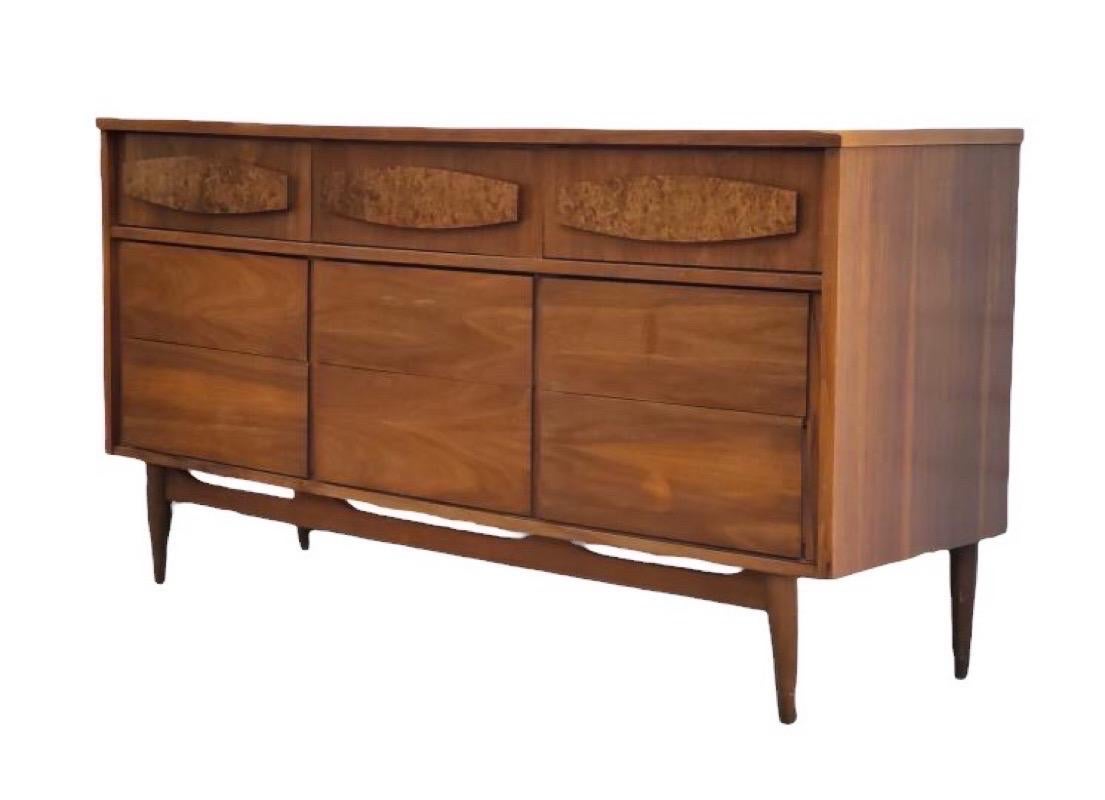 Vintage Mid Century Modern Dresser with Burl-wood Accents

Dimensions. 60 W ; 18 D ; 31 1/2 H