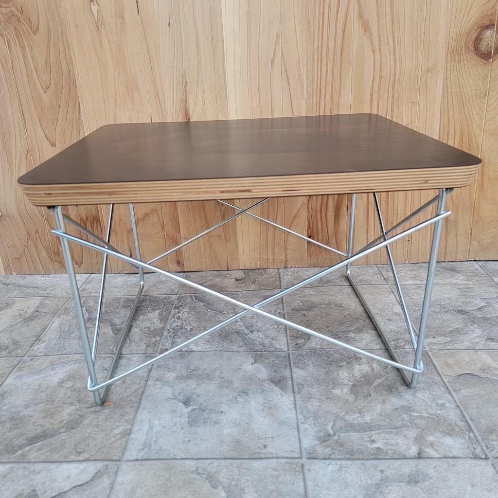 Vintage Mid Century Modern Eames Herman Miller Table 

This small table would is a cute stand that you can display statues, drinks, or other small items on. The item contains a maker's mark for Herman Miller by Eames on the bottom of the table top.