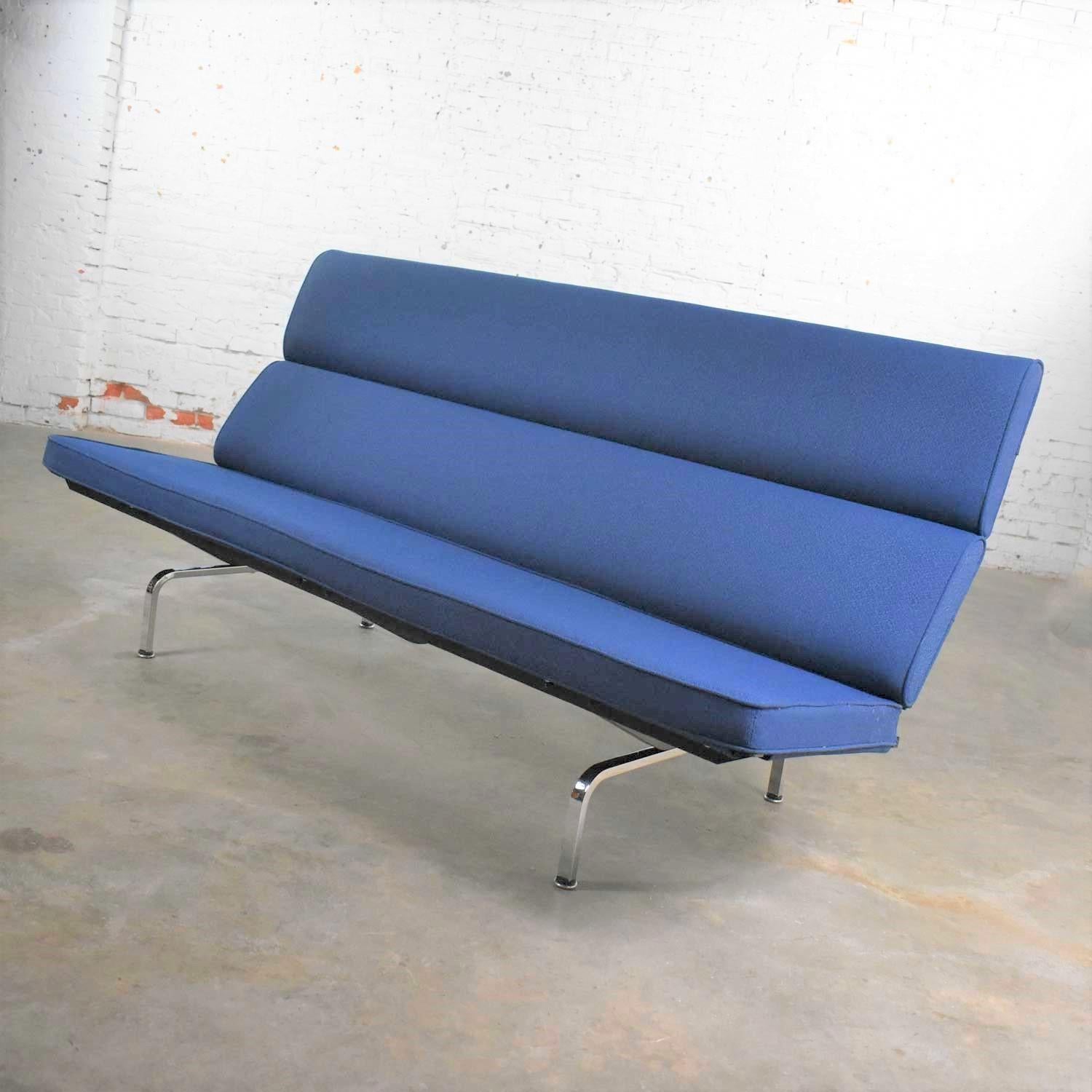 Handsome blue Mid-Century Modern sofa compact designed by Charles and Ray Eames for Herman Miller. It is in wonderful original vintage condition. We have not found any outstanding flaws only normal wear for age. There is a small spot on the back