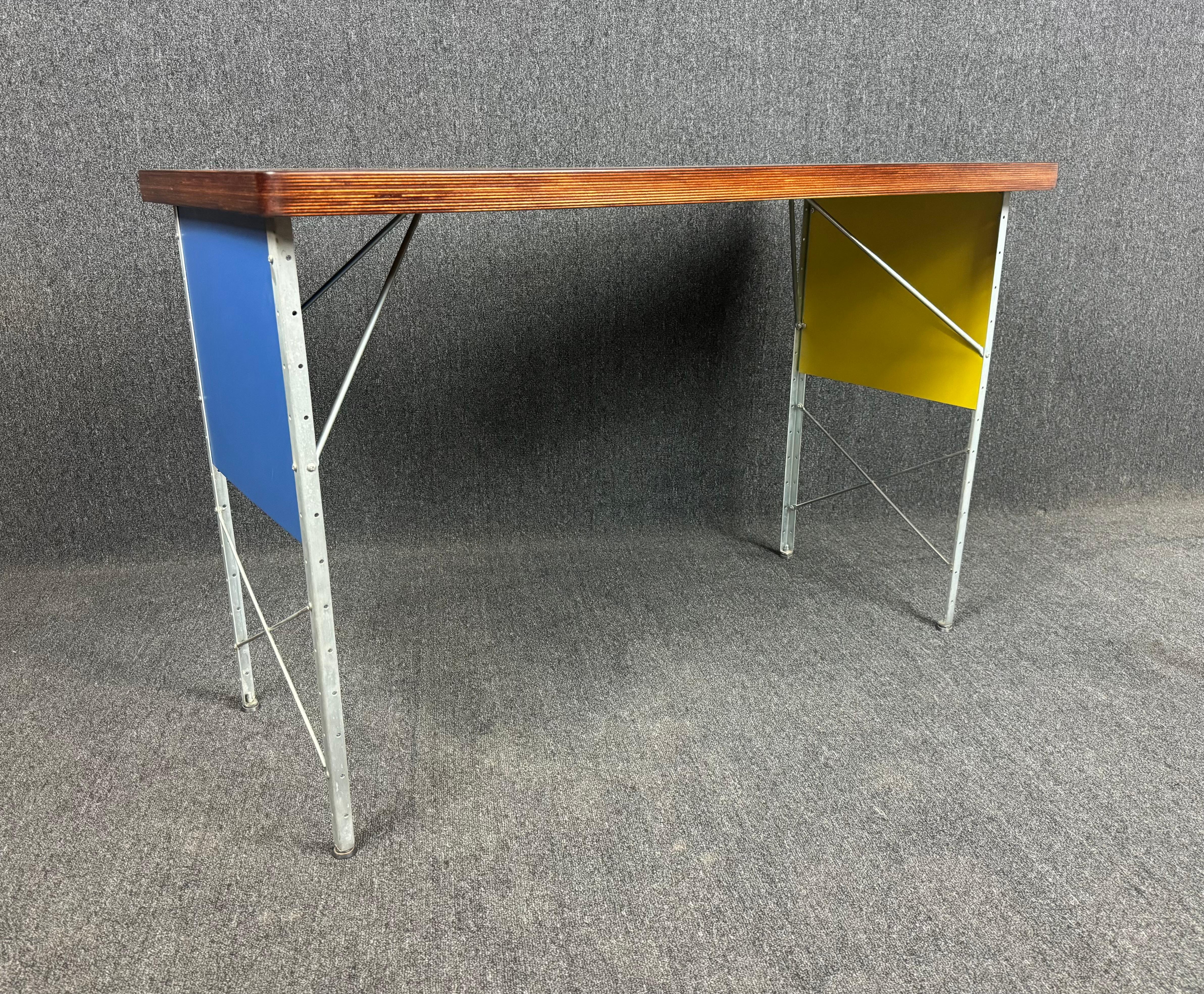 Here is a beautiful custom ordered compact writing desk - console table manufactured by Modernica in Los Angeles, CA in 2013.
This special table features a laminate beech top refinished with a medium brown walnut stain, a steel metal frame showing