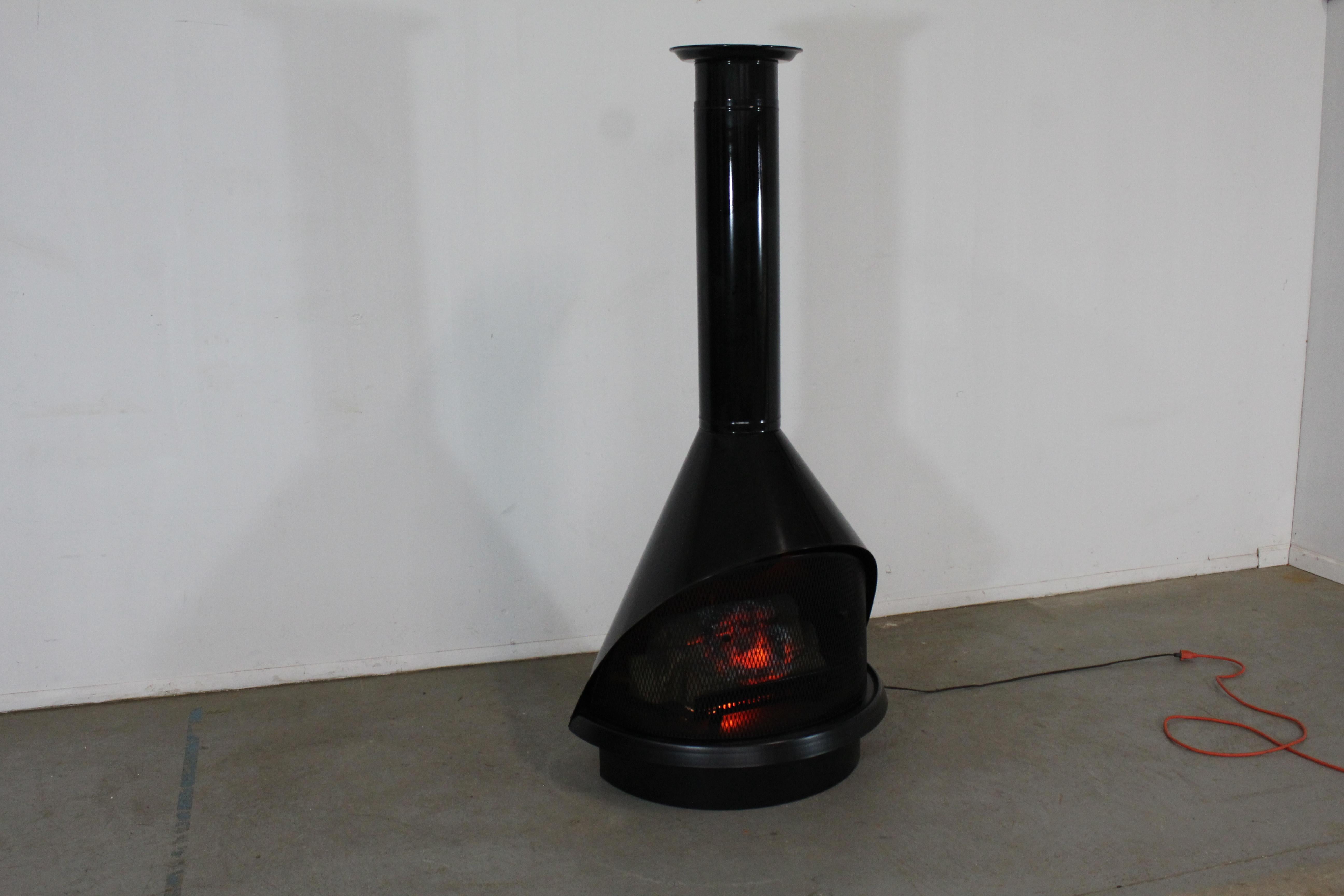 Vintage Mid Century Modern Electric Preway Conical Style Fireplace Jet Black

Offered is an architectural treat a Vintage Mid Century Modern Conical Fireplace. Features 1 piece of pipe as well as the ceiling collar. The fireplace has great lines and