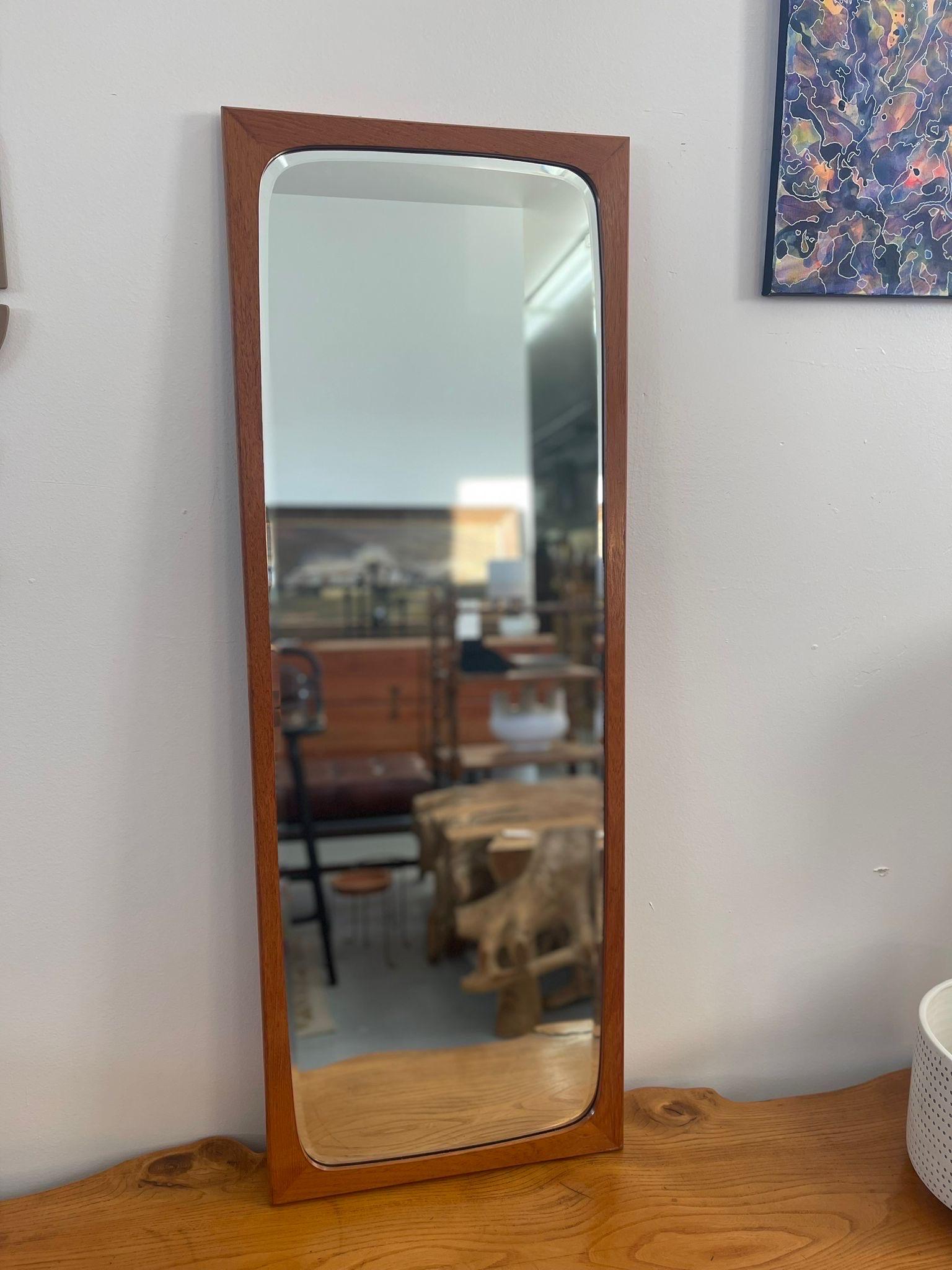 Possibly Teak Framing. Mirror has Rounded Mid Century Modern Style Corners. Beveled Mirror. Vintage Condition Consistent with Age as Pictured.

Dimensions. 16 1/2 W ; 1 D ; 46 H