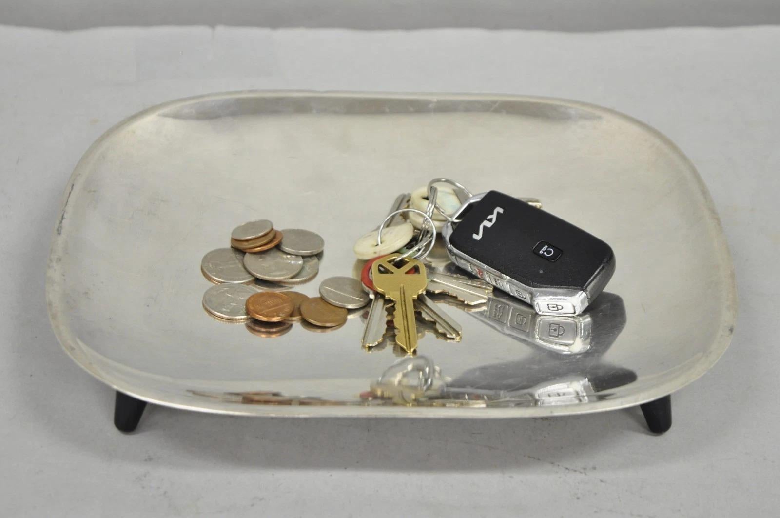 Vintage Mid Century Modern FB Rogers 5812 Silver Plated Footed Trinket Dish Raised on Black Tapered Feet19. Circa Late 20th Century. Measurements: 1.5