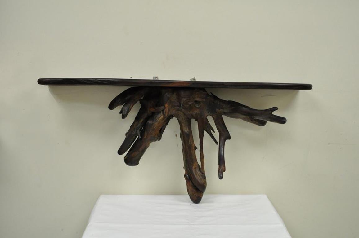 Vintage free-form wall hanging slab walnut wall shelf in the George Nakashima style. Item features wood is believed to be solid black walnut, maker is unknown, great aesthetic appeal and quality, circa mid-20th century, USA. Measurements: 19.75
