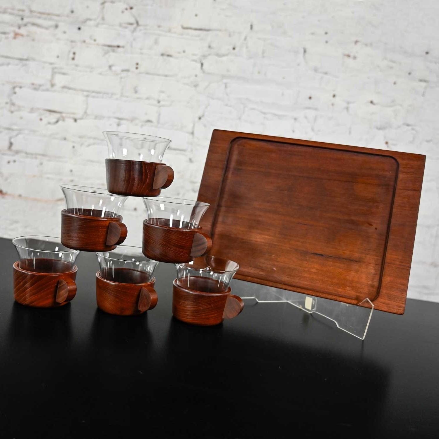 Wonderful vintage Mid-Century Modern Galatix hand-made Burma teak tea service set of 6 glass inserts, 6 Burma teak cup vessels, and a Burma teak serving tray. Beautiful condition, keeping in mind that this is vintage and not new so will have signs