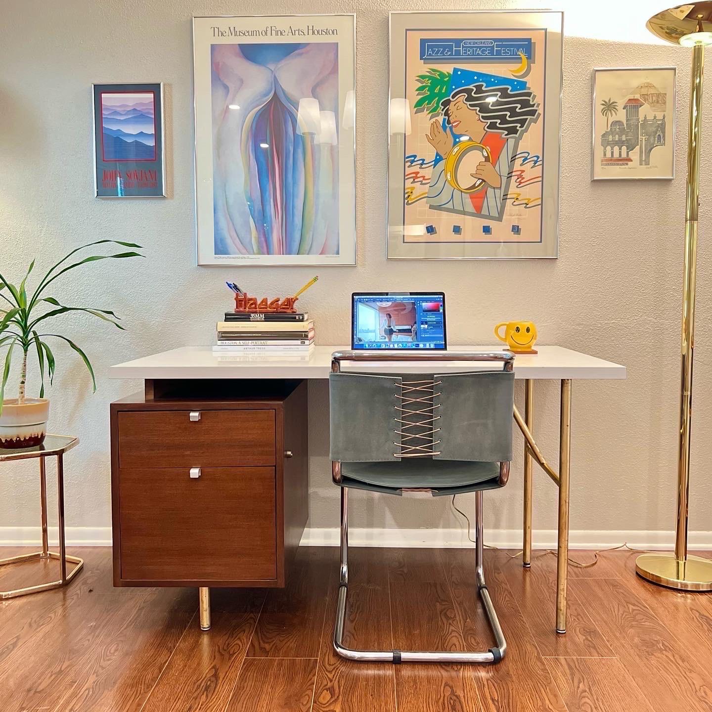 Super iconic Executive desk designed by George Nelson and made by Herman Miller in the 1960s. Walnut pedestal, chrome pulls embossed with Herman Miller stamp. Aluminum legs have been done with a gold leaf paint. White walnut Formica top. Drawers