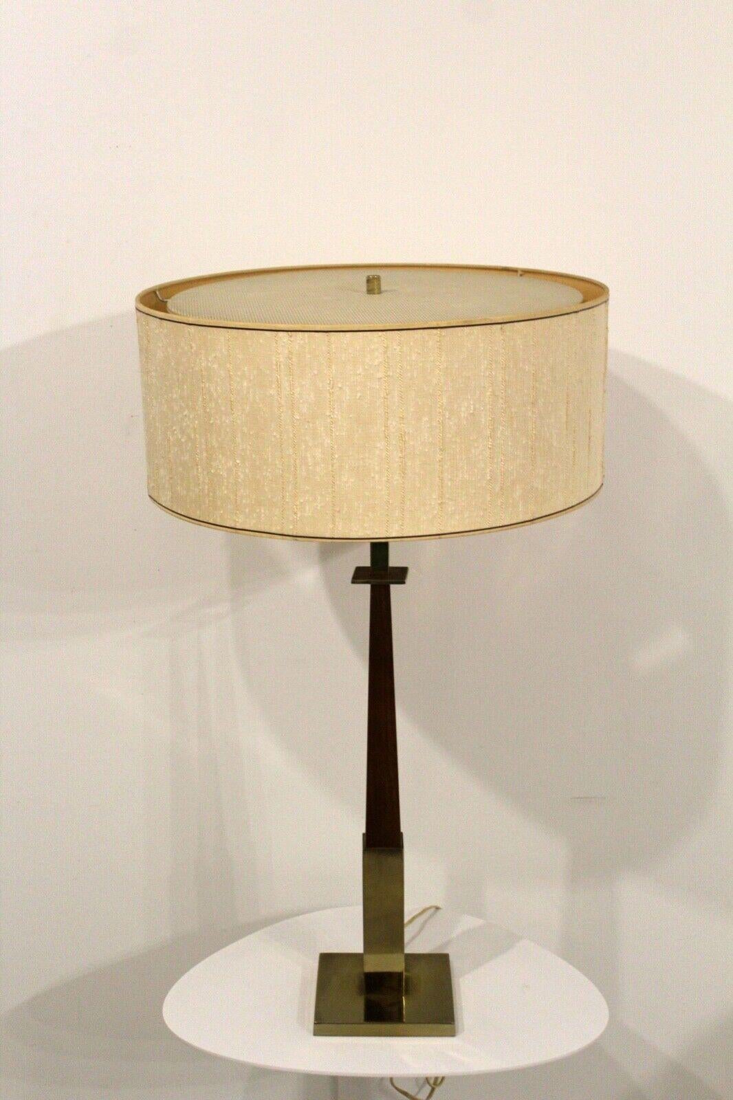 For your consideration is this vintage Gerald Thurston for Lightolier brass & walnut table lamp with the original shade. Dimensions: 18 diameter x 30.5 height.
 