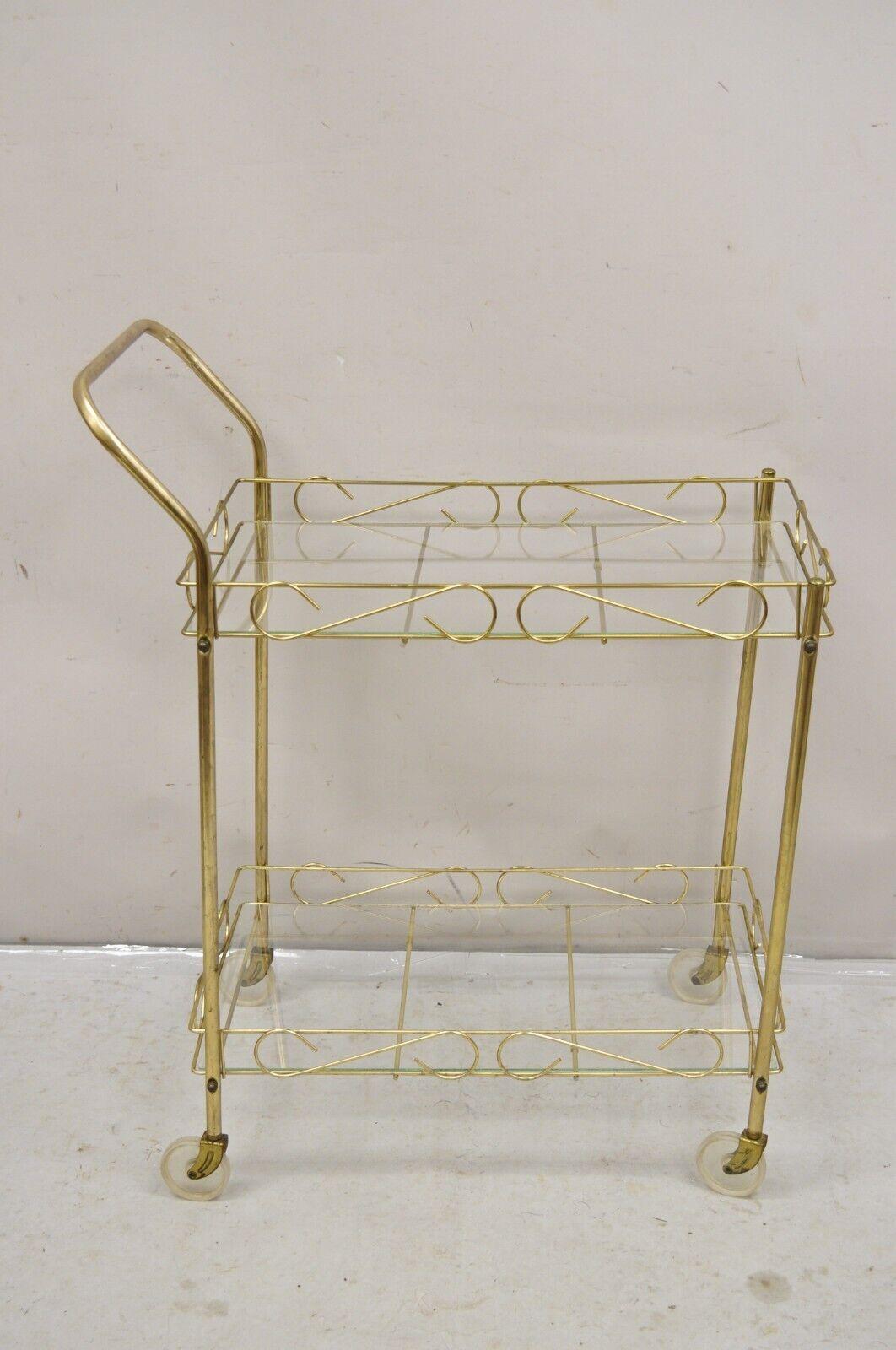 Vintage Mid Century Modern Gold Metal 2 Tier Rolling Bar Tea Cart Server with Glass Shelves. Circa 1970s. Measurements: 35
