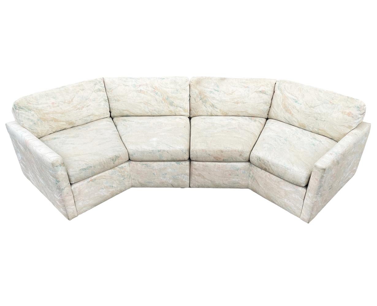 A sleek modern sofa in a hexagonal form circa 1970's. It features a two section design with low profile feet. Fabric is original and needs recovering. Foam and padding are fine. Seat depth measures 22.5 inches.