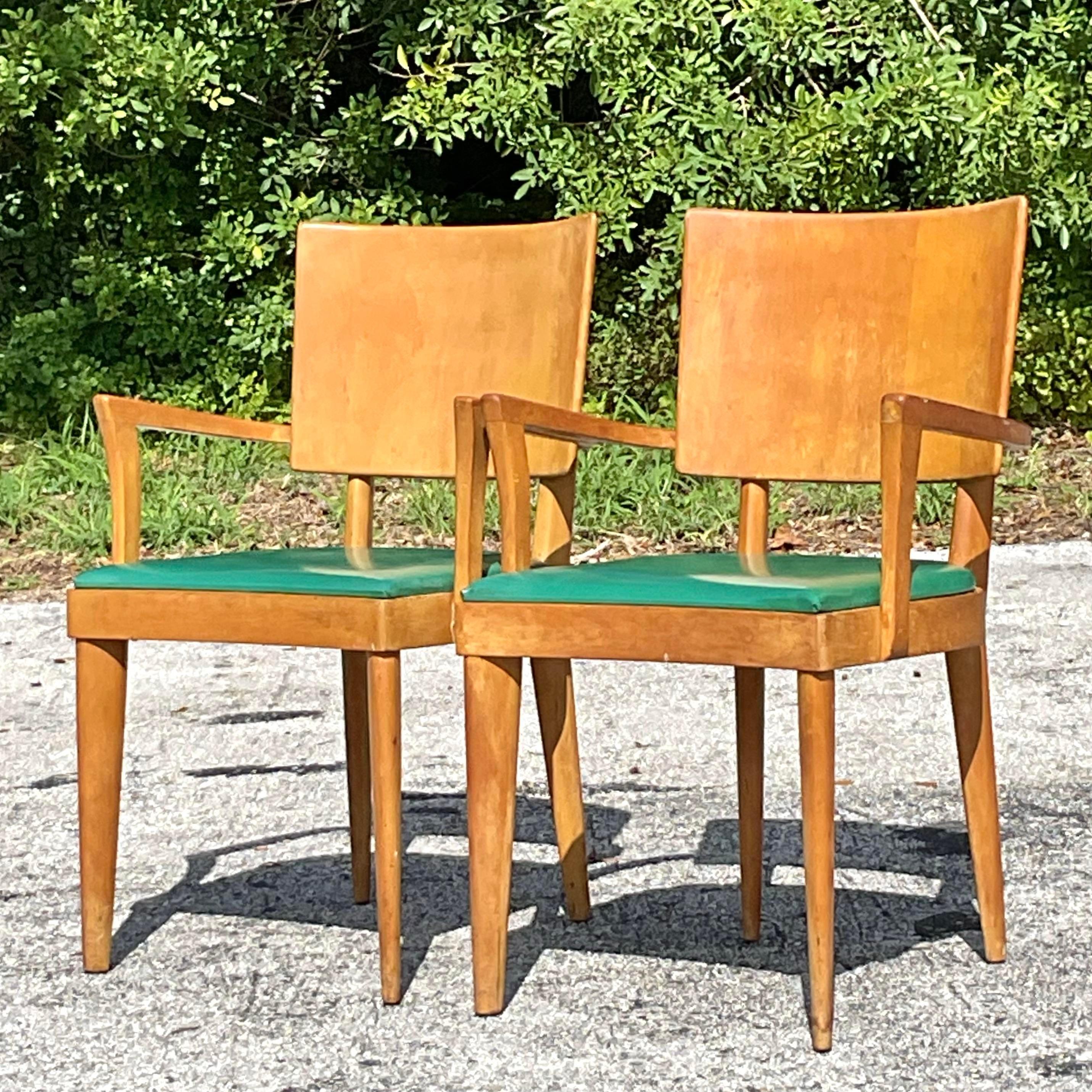 Add a touch of classic Mid-Century Modern charm to your space with this pair of Heywood Wakefield 