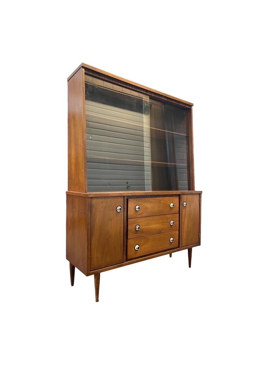 Vintage Mid-Century Modern hutch or buffet with display cabinet
Dimensions. 48 W ; 16 D ; 65 H
Top Shelf 45 W ; 9 1/2 D ; 10 1/2 H
Middle Shelf 45 W ; 10 1/2 D ; 11 1/2 H
Bottom Shelf. 45 W ; 11 D ; 10 H
Cabinet. 10 W ; 14 D ; 18 H.