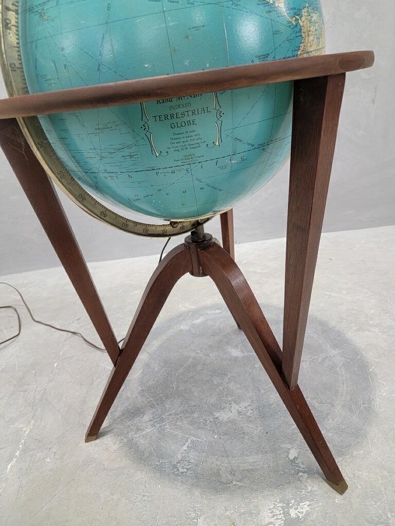 Vintage Mid Century Modern Illuminated World Globe on Mahogany Stand By Edward Wormley for Dunbar

This light up globe is perfect for anyone searching for eclectic light sources. This soft light will make any living room or waiting area cozier.
