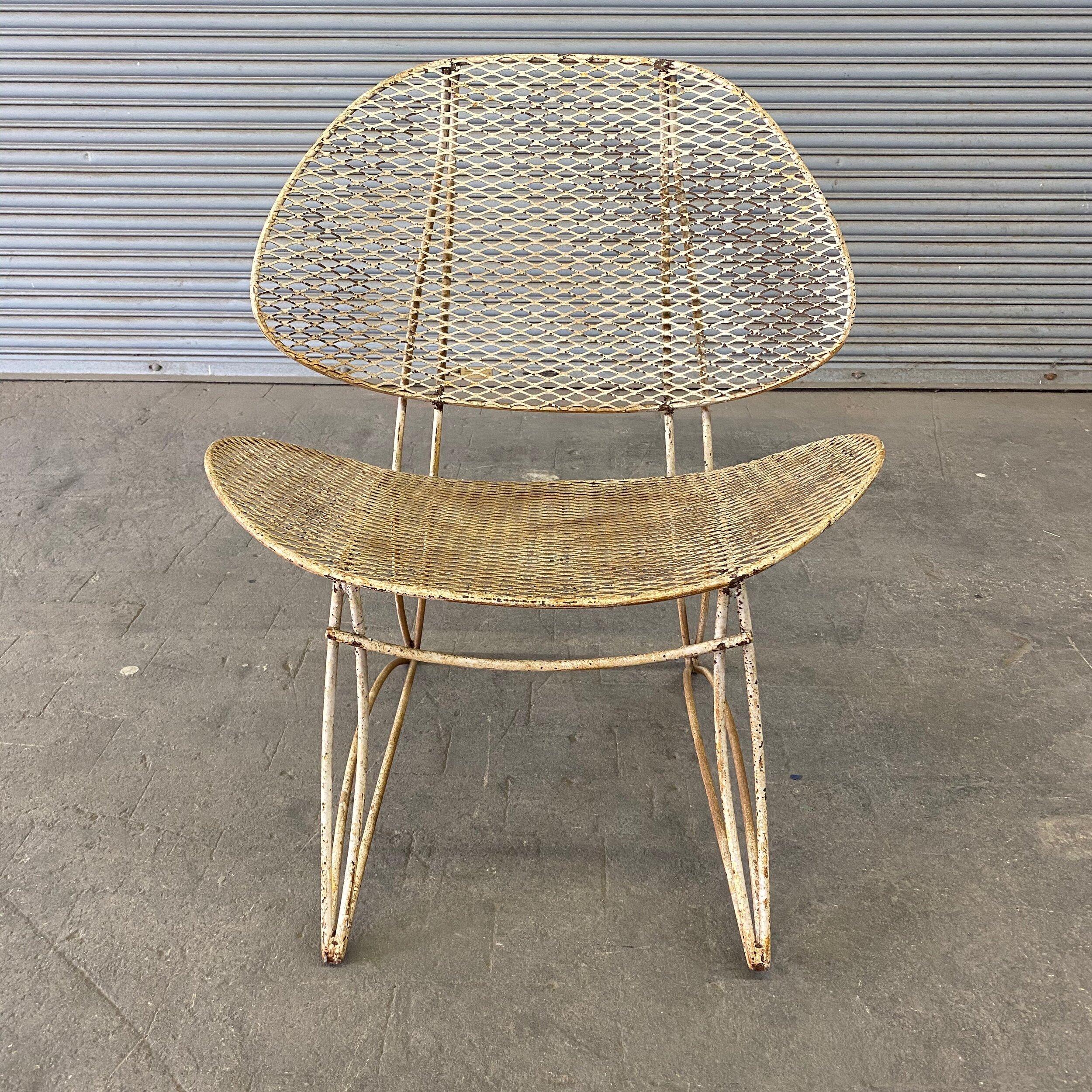 This magnificent 1960s mid century modern American garden chair has a sturdy curved iron frame with the original oxidized white paint. The distressed paint finish gives it a unique shabby chic appeal.

Ref #: G1013-01

Dimensions: 30