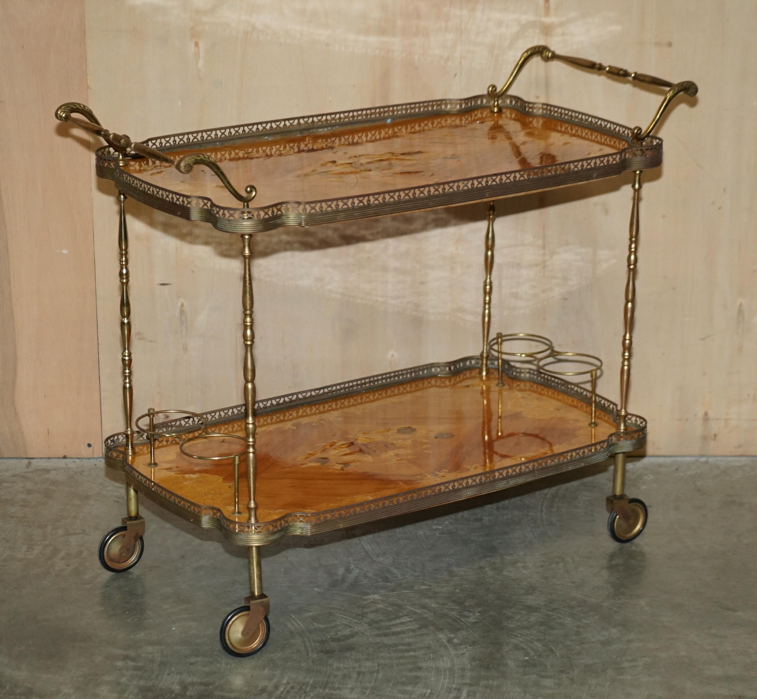 Royal House Antiques

Royal House Antiques is delighted to offer for sale this Mid Century Modern Italian brass and laminate inlaid drinks serving trolley 

Please note the delivery fee listed is just a guide, it covers within the M25 only for the