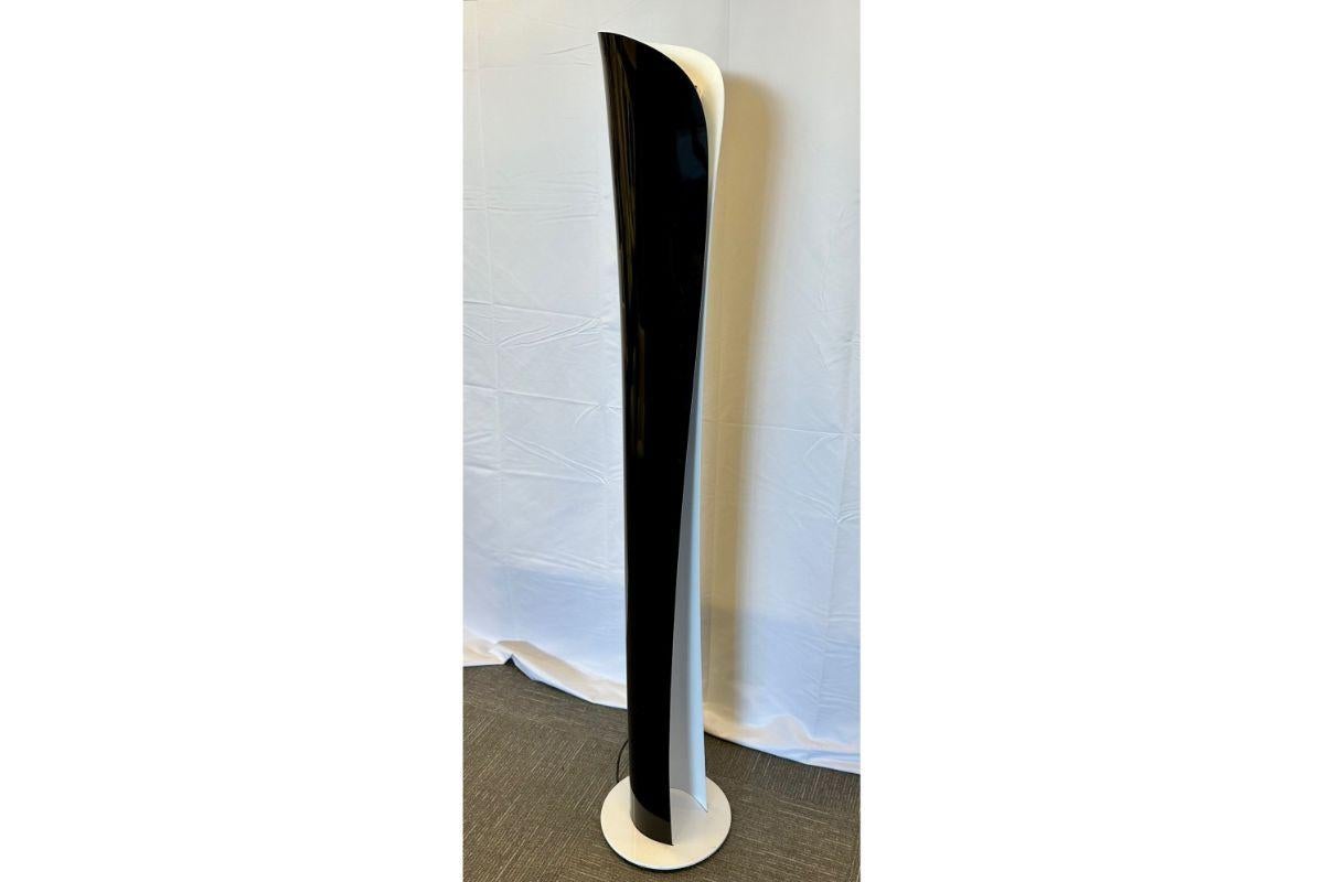 Vintage Mid-Century Modern Italian Lacquered Floor Lamp, Artemide, Labeled Italy
 
A 'Cadmo' floor light by Karim Rashid for Artemide, Italy
 
A curved aluminum panel envelopes and releases soft indirect light upwards while a separate source