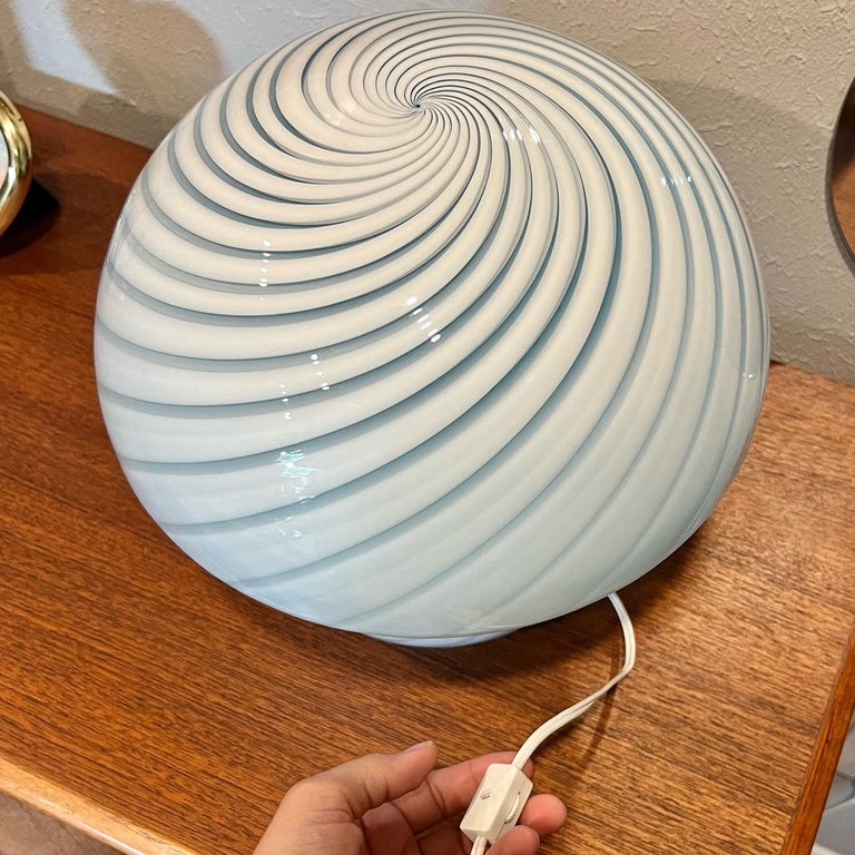 A beautiful vintage Italian Murano mushroom lamp in pale blue and white. These pieces are hand blown and each one is unique. No chips or cracks and is in excellent condition A true work of art! ??

Dimensions:
12” H x 12” D.