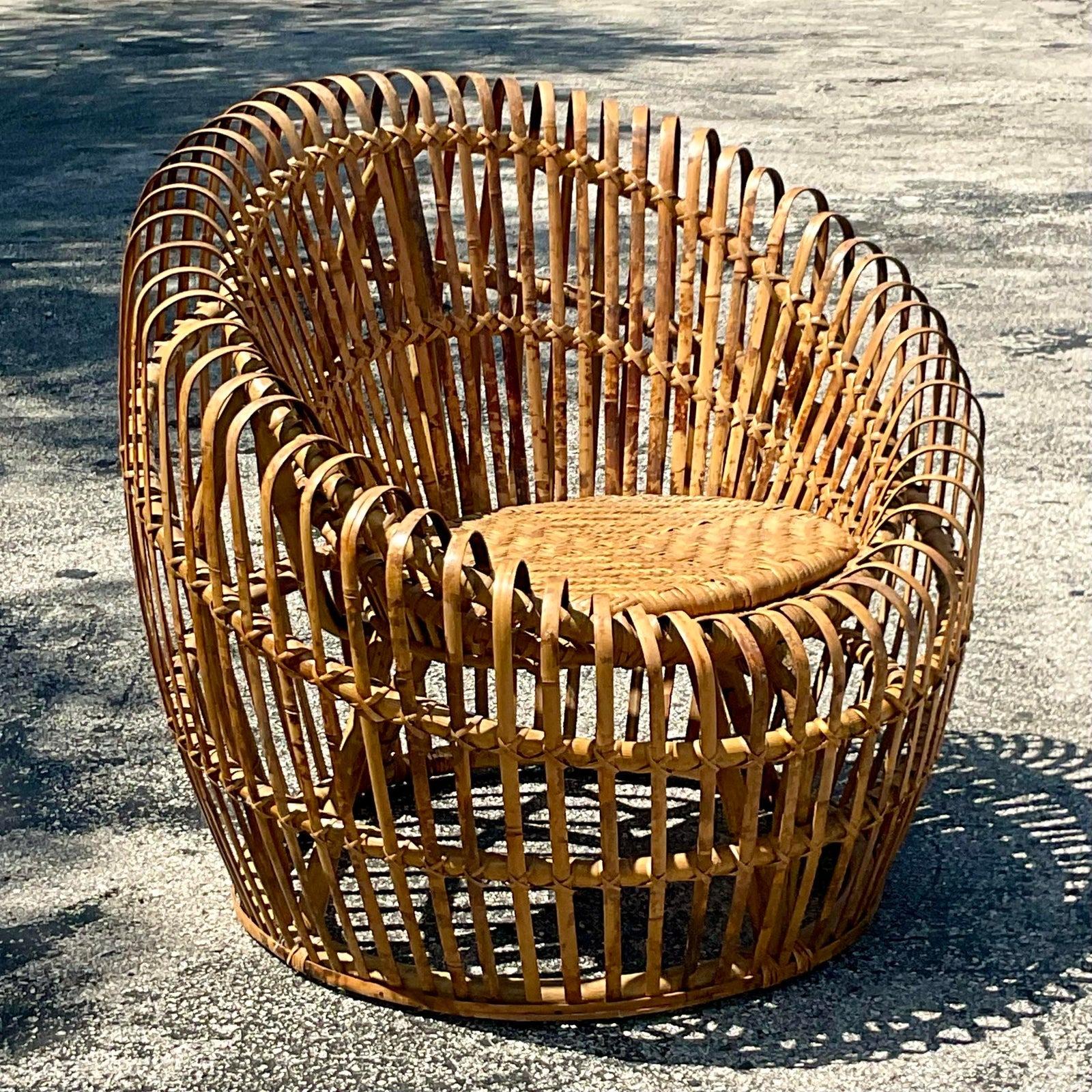A spectacular vintage Italian pod chair. Chic slatted bamboo with an inset woven rattan seat. Gorgeous patina from time. Acquired from a Palm Beach estate.