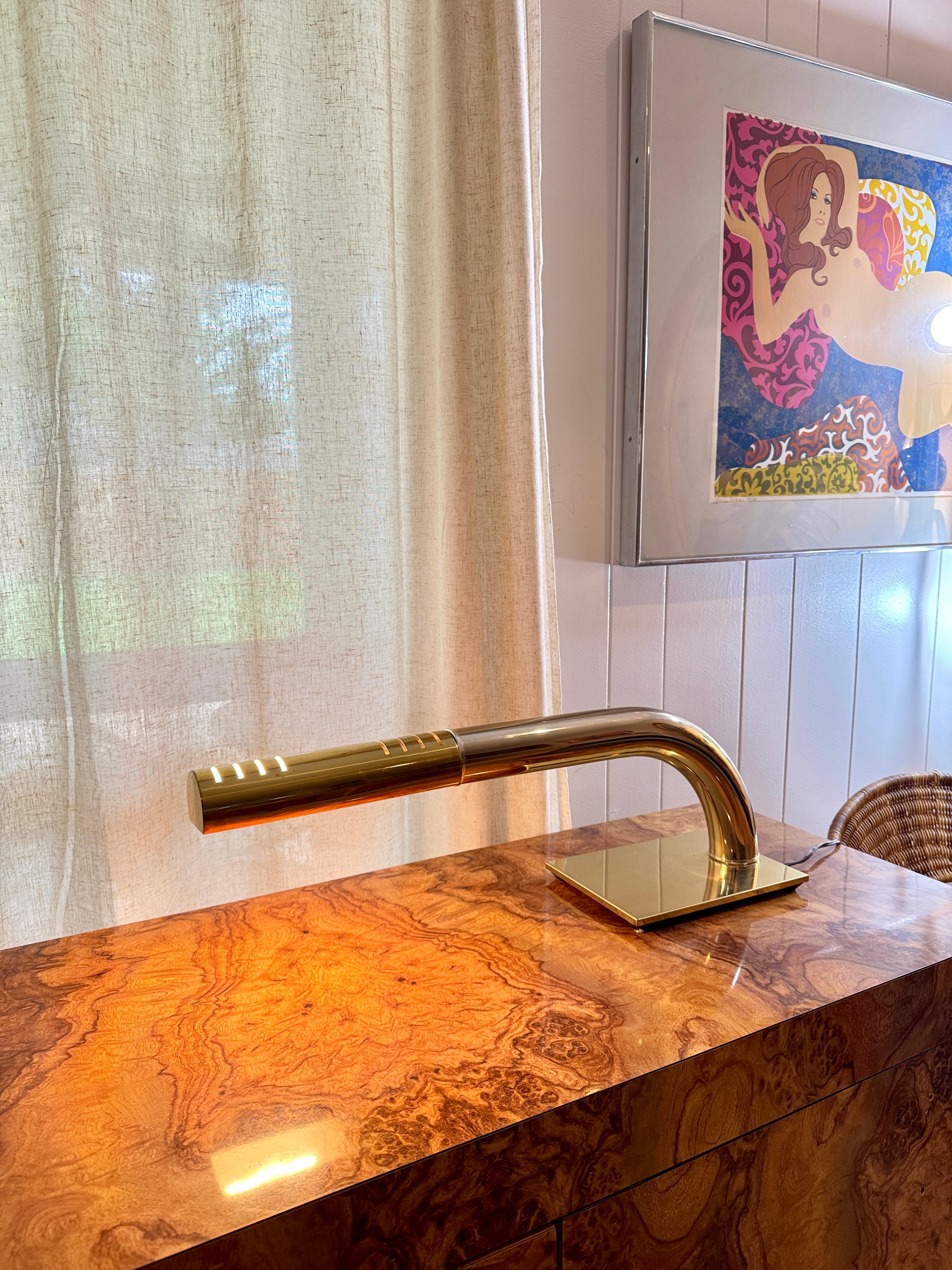 Vintage mid century modern Jim Bindman tubular brass touch lamp produced by the Rainbow Lamp Company, circa 1970s. This sleek, sculptural design features a tubular brass arm giving it a futuristic style. With no visible switch, a simple touch
