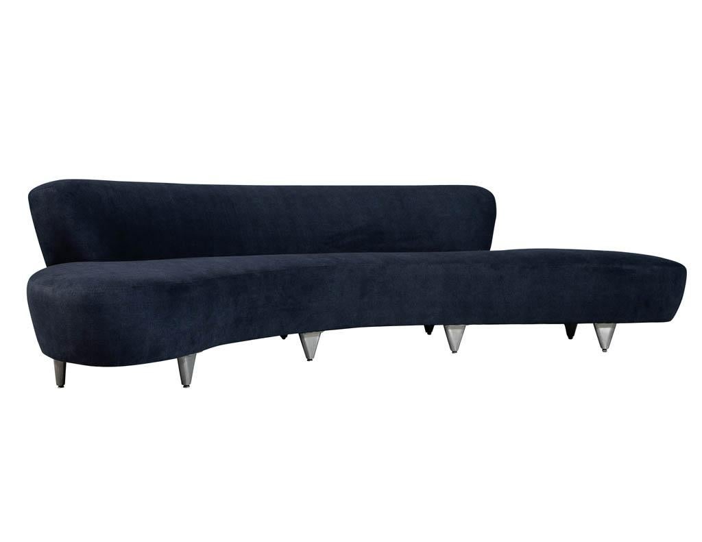 Vintage Mid-Century Modern curved sofa. Graceful and sleek curved and Contoured design upholstered in Maxwell – Baxter ESS #800 Navy with a top stitch, perched atop brushed steel legs. Iconic Mid-Century Modern Design circa 1960s fully restored by