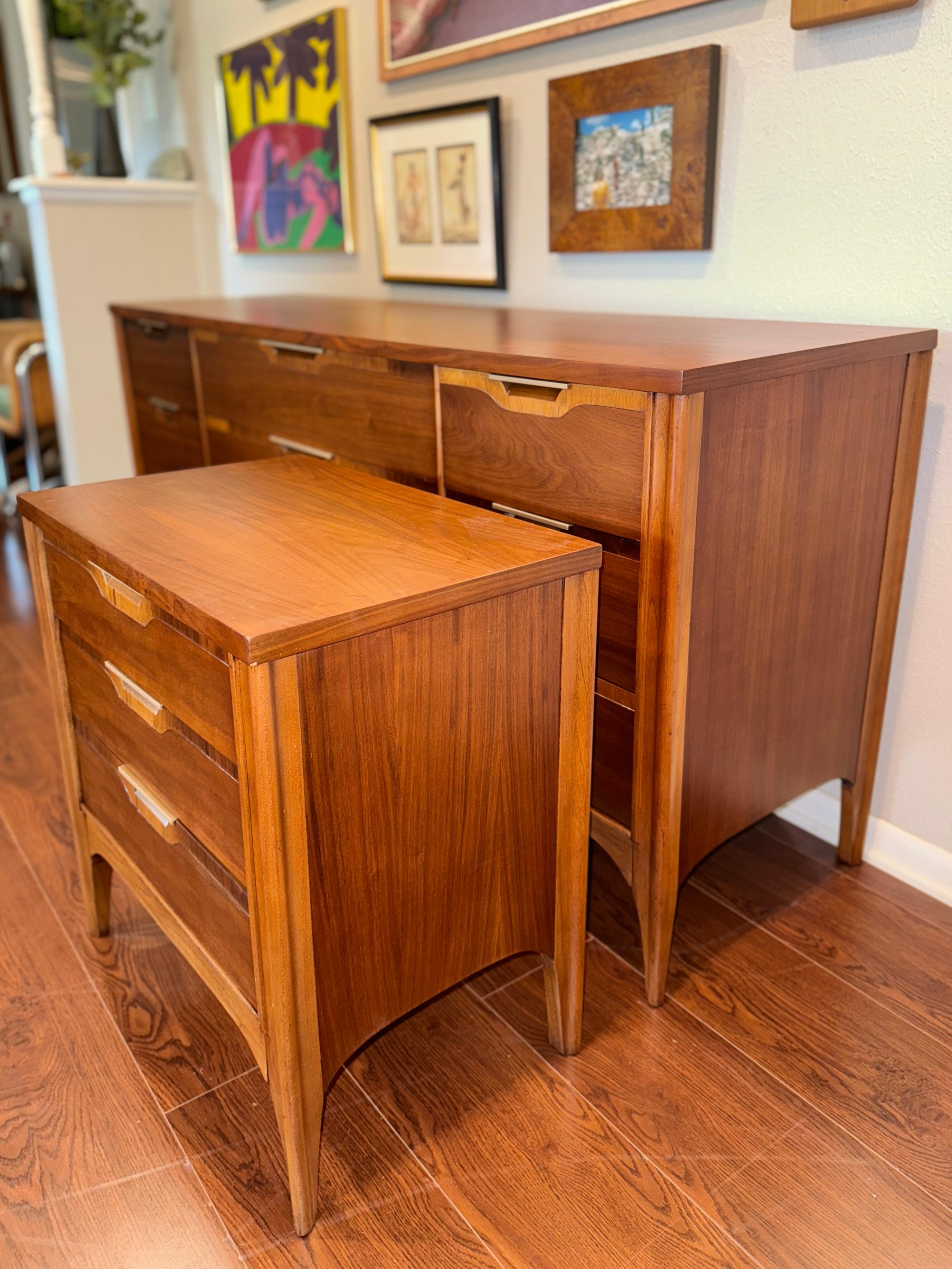 Vintage mid century modern Kent Coffey lowboy dresser and matching nightstand from the “impact” collection, circa 1960s. Recently fully refinished and in excellent condition. All drawers open and close smoothly. 

Dresser 64.5” W x 31” H x 18.5”