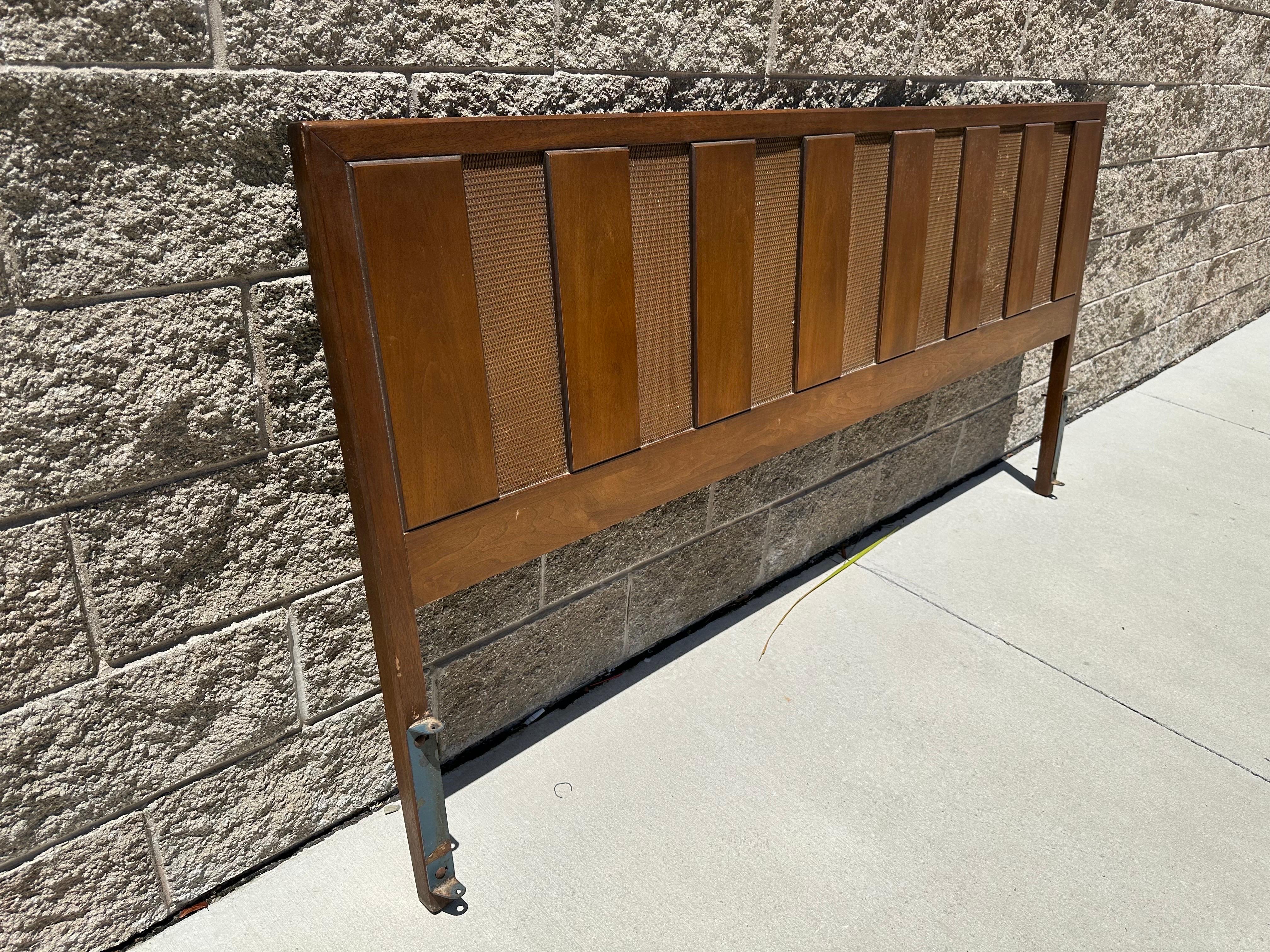 Add a touch of retro flair to your bedroom with this vintage king size headboard. Crafted from high-quality walnut wood in a mid-century modern style, this headboard is the perfect choice for anyone who loves classic design. The rich brown color