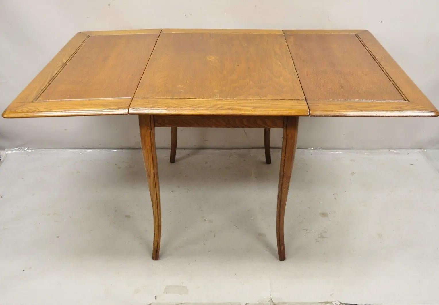 20th Century Vintage Mid Century Modern Klismos Saber Leg Oak Drop Leaf Dining Table For Sale