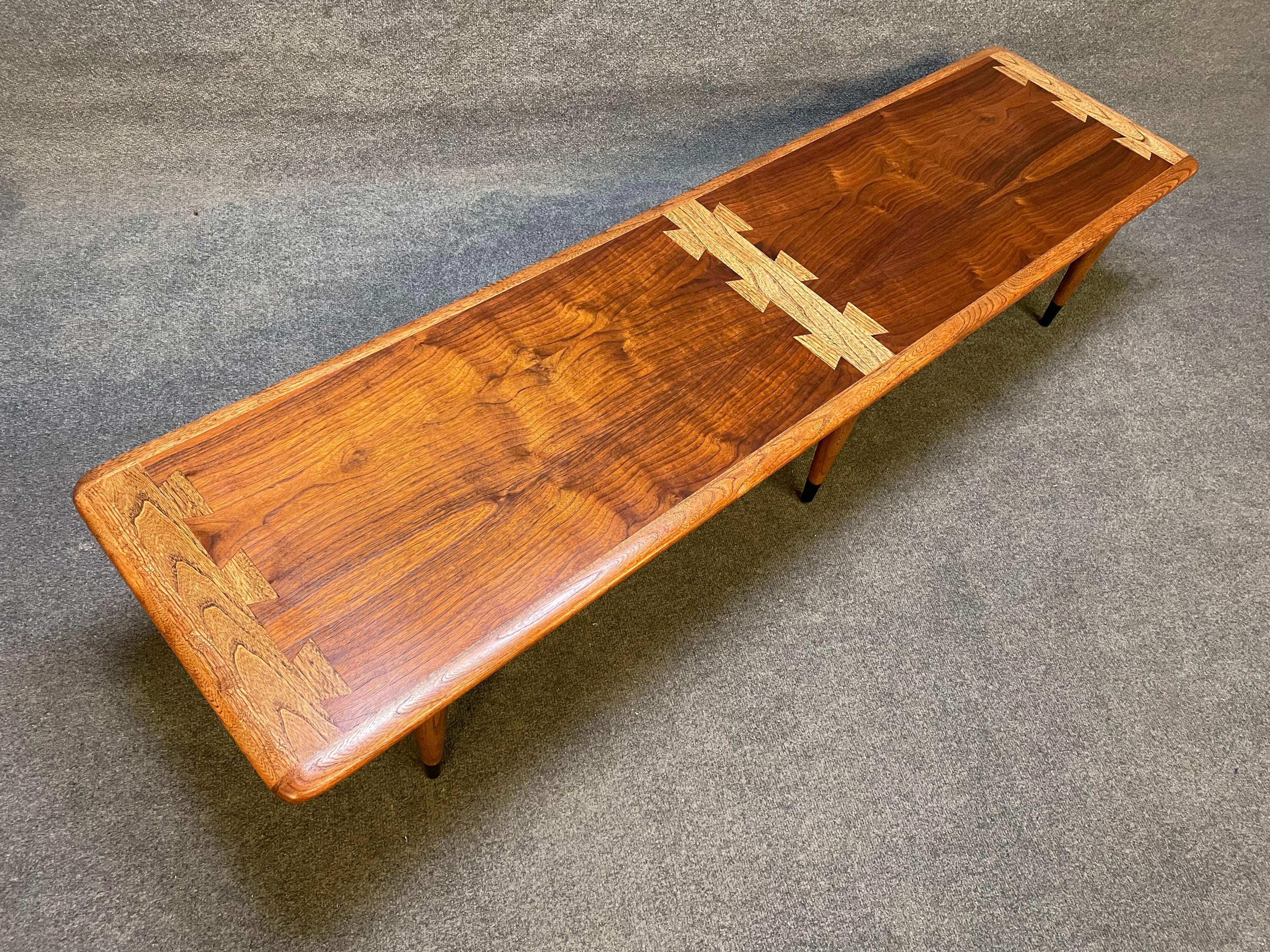 Here is a beautiful Mid-Century Modern coffee table in walnut and oak from the 