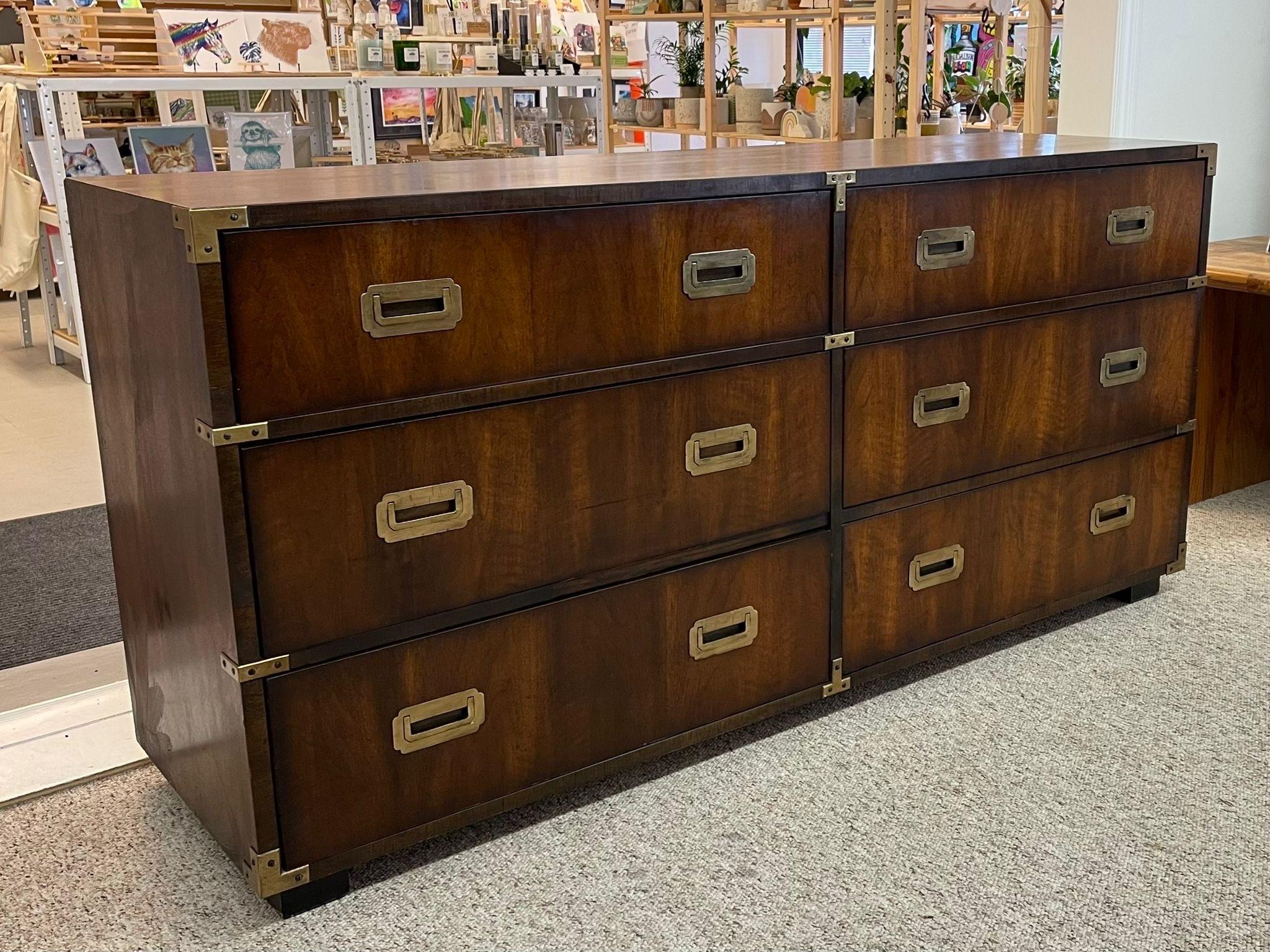 Mid Century Lane Dresser with brass toned accents, original to the piece. Dovetailed Drawers makers mark inside. Walnut Toned wood with beautiful wood grain. Vintage Condition Consistent with Age as Pictured.

Dimensions. 62 W ; 18 D ; 30 H