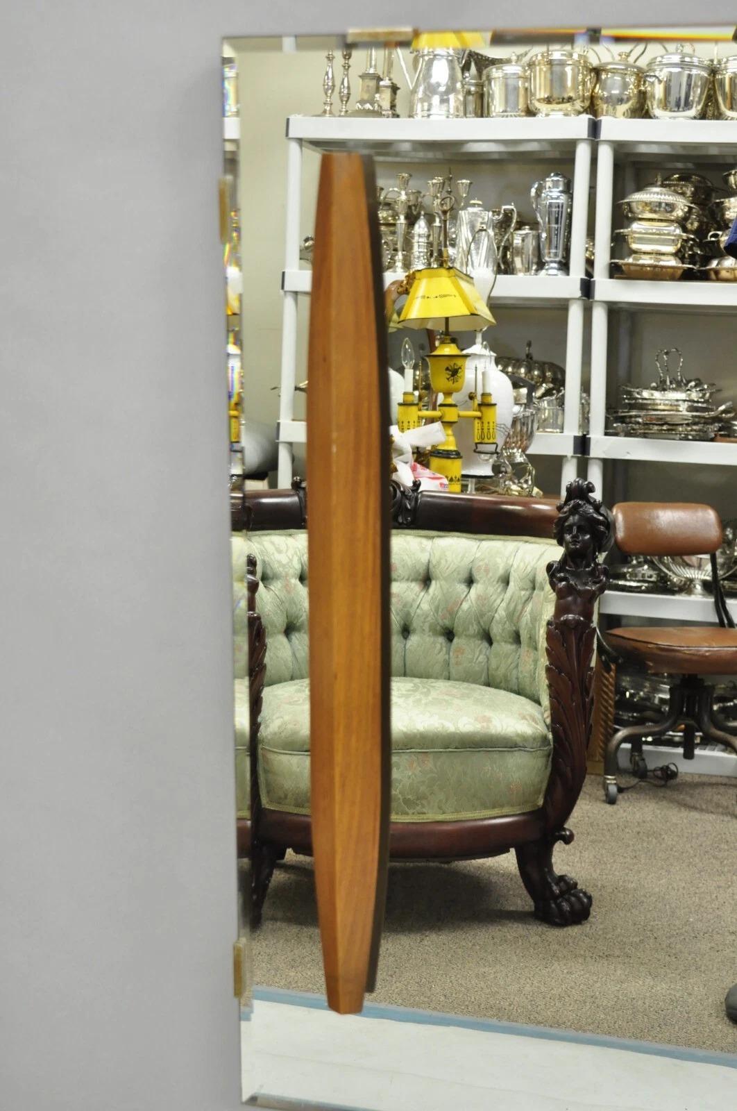 Vintage Mid Century Modern  Large Beveled Glass Wall Mirror with Raised Sculpted Walnut Accents. Circa Mid 20th Century. Measurements: 36