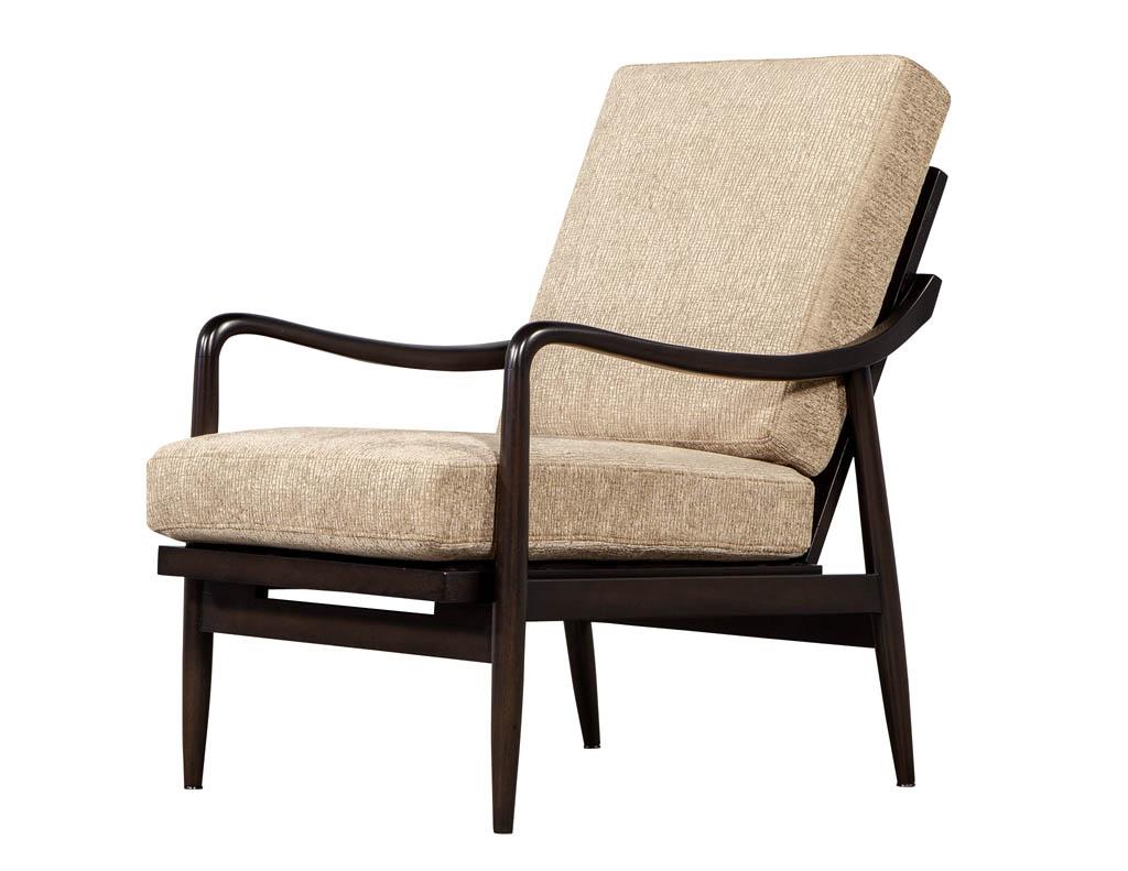 Vintage Mid-Century Modern lounge chair. Newly refinished and reupholstered by our artisans. Featuring sleek curved walnut frame and textured beige designer fabric.

Price includes complimentary scheduled curb side delivery service to the