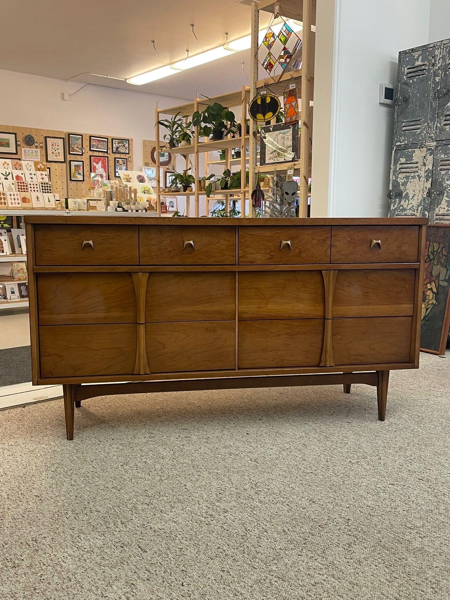 Unique Metal Pulls on the Top Two Drawers, with the Lower Drawers having Sculpted Wood Handles. Makers Mark Located Inside Top Drawer. Drawers are Dovetailed. Reminiscent of Vintage Brasília Collection. Classic Tapered Legs and Walnut Tone. Circa