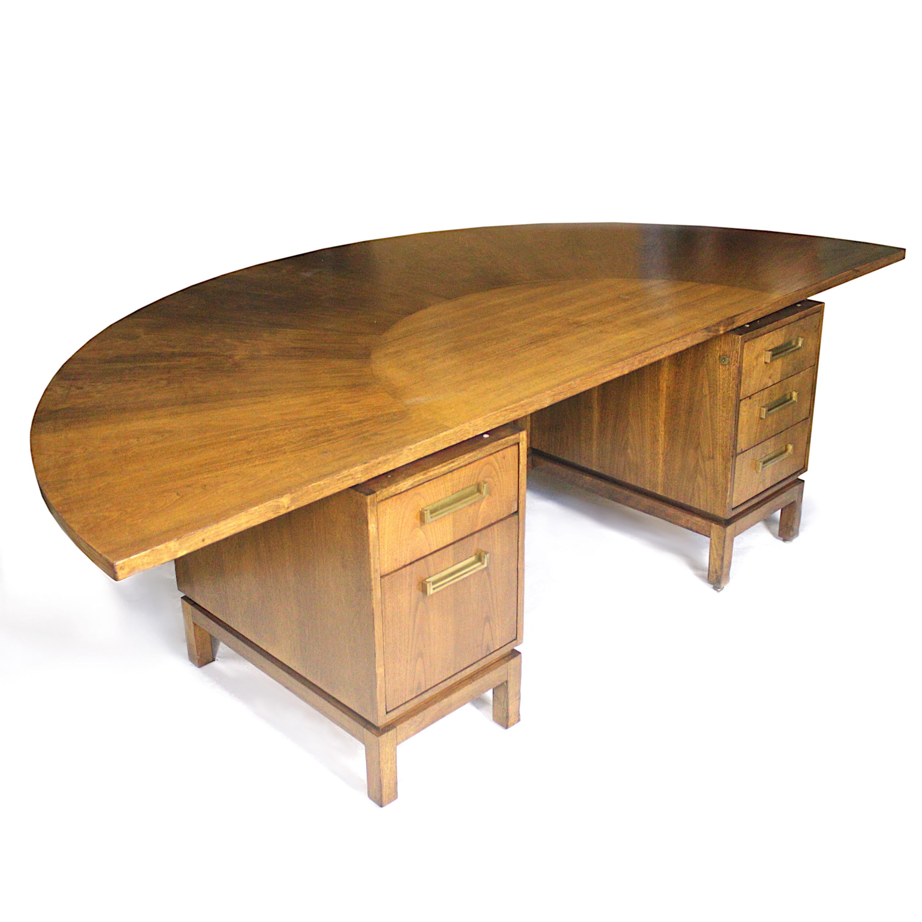 This spectacular Mid-Century Modern executive desk was manufactured by the Dunbar Furniture Co. of Berne, IN, and is accompanied by a matching sonsole. Desk features a beautiful Asian-influenced, mahogany base with gorgeous brass, hinged drawer